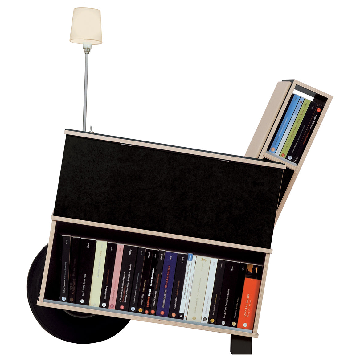 The Moormann Bookinist, an abstract wheelbarrow-shaped bookshelf, stylishly combines book storage with design. It has a light frame with tilted compartments for books and a small lamp on top, set against a white background—ideal for beside your reading chair.