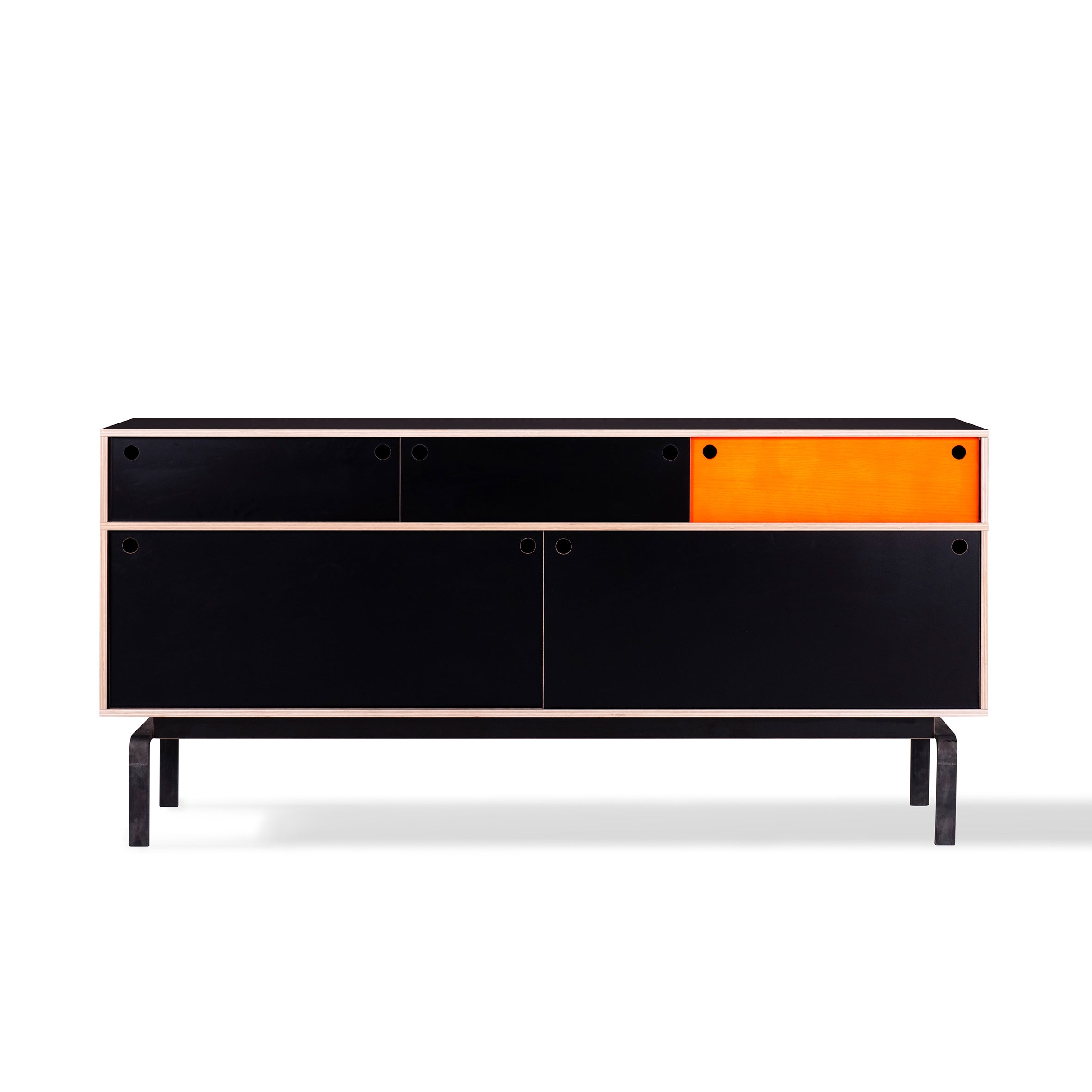 The Moormann Egal sideboard, made from birch plywood, features a minimalist black design with a vibrant orange compartment on the top right. It stands on a simple black metal frame and offers a sleek, contemporary look ideal against a white background.