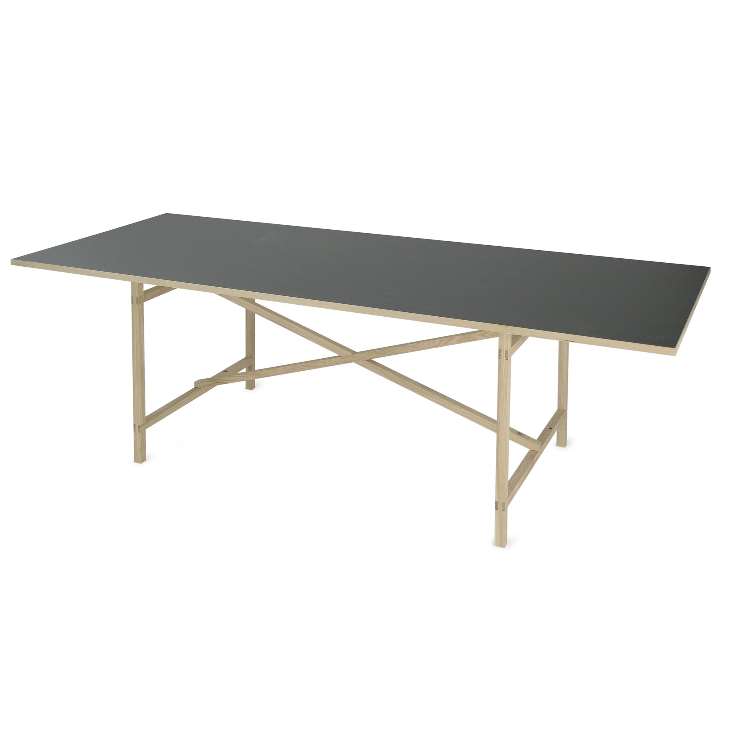 The Egon by Moormann is a modern rectangular wooden dining table with a dark surface and sleek metallic frame, inspired by Franz Volhard. Its minimalistic design features crossbars for support and stands out against a white background.