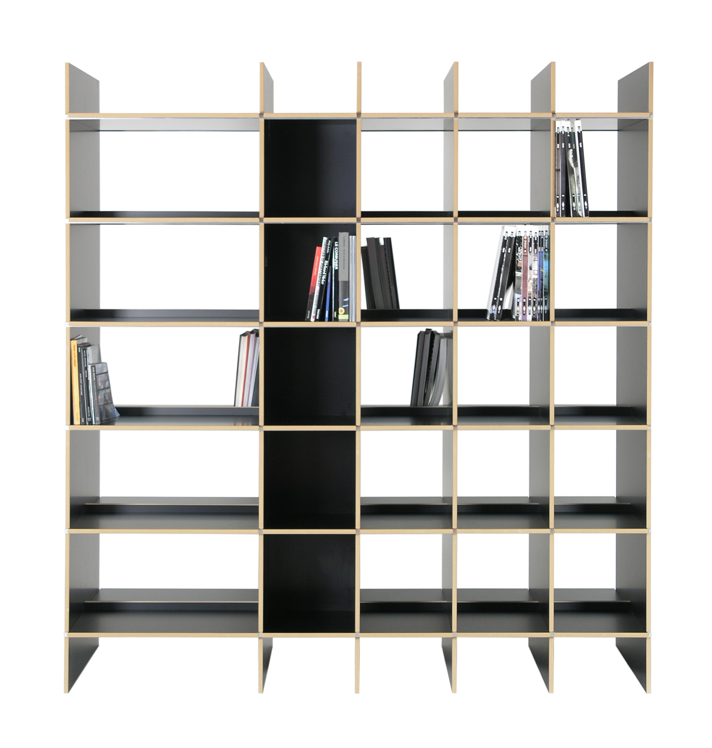 A modern, black Moormann FNP Archive shelf with a grid-like design, partially filled with books and DVDs, stands freestanding against a plain white background, showcasing its symmetrical pattern.