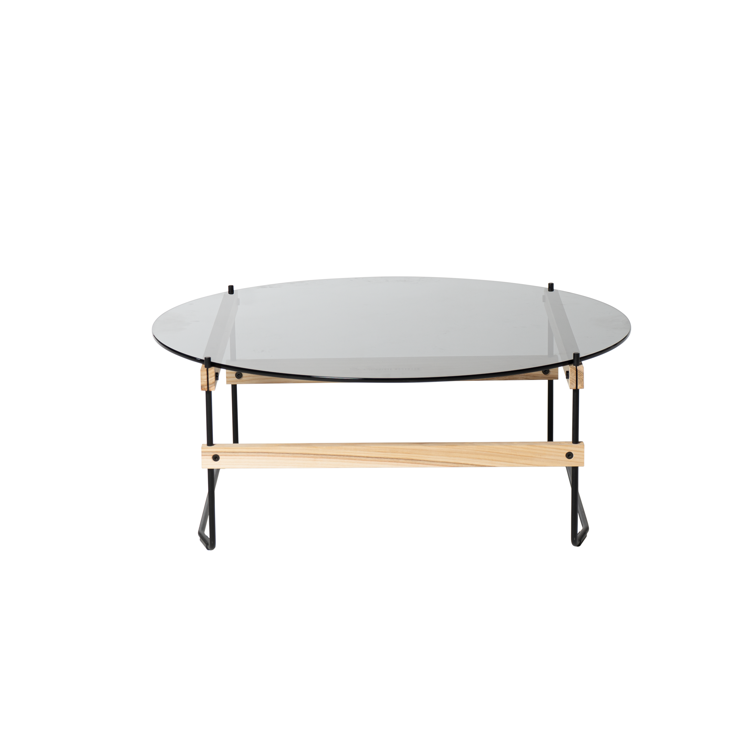 The Netto Coffee Table by Moormann features a sleek, round grey tinted ESG glass top, supported by a wooden frame and black metal legs—blending natural wood with industrial elements for a contemporary look.