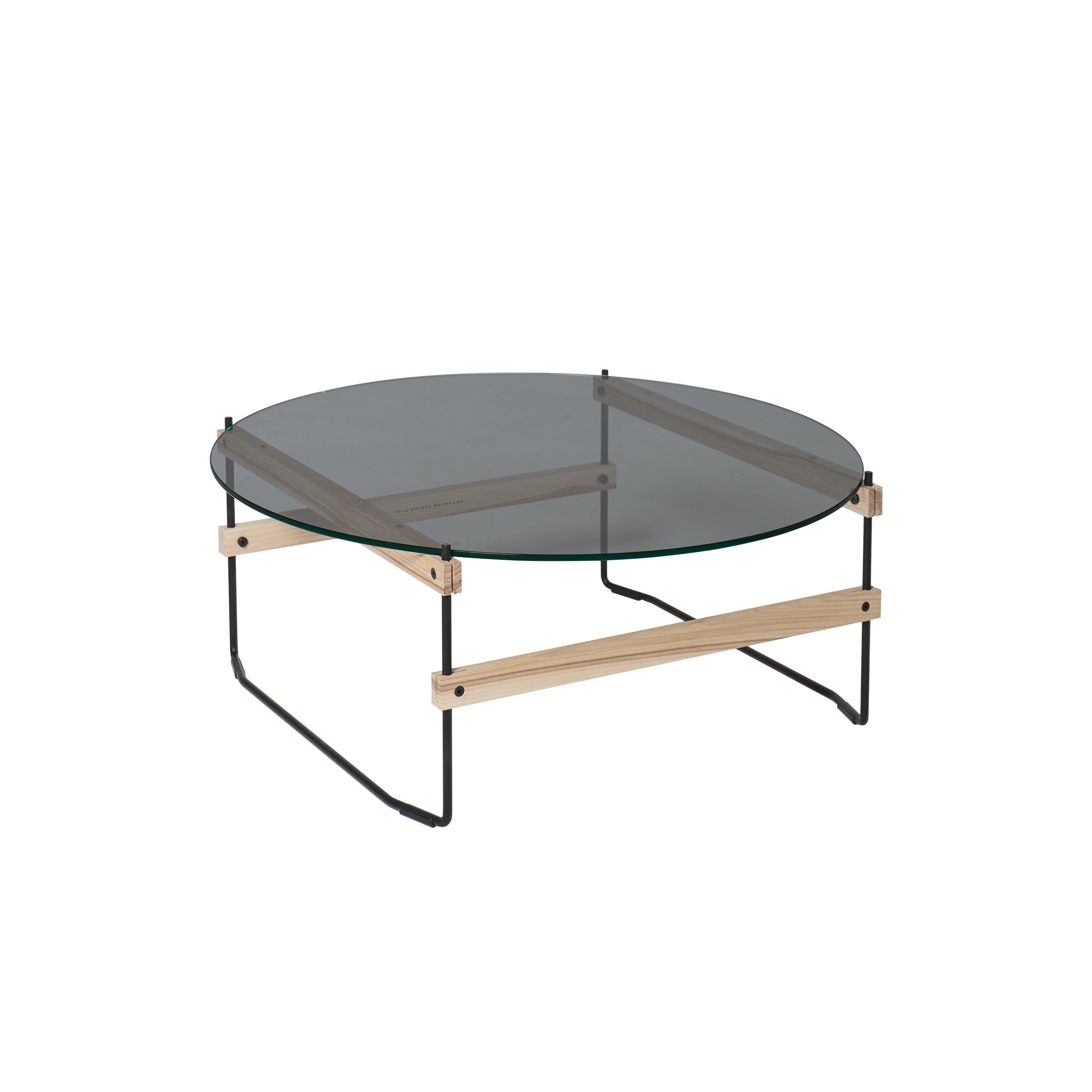 The Netto Coffee Table by Moormann features a round, grey-tinted ESG glass top supported by a minimalist frame with wooden elements and sleek metal legs.