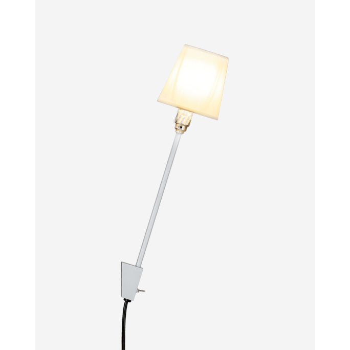 The wall-mounted Rosi Lamp by Moormann embodies a modern design with a long white stem and an off-white square, slightly tilted lampshade. The black power cord is visible at the base against a plain white background.