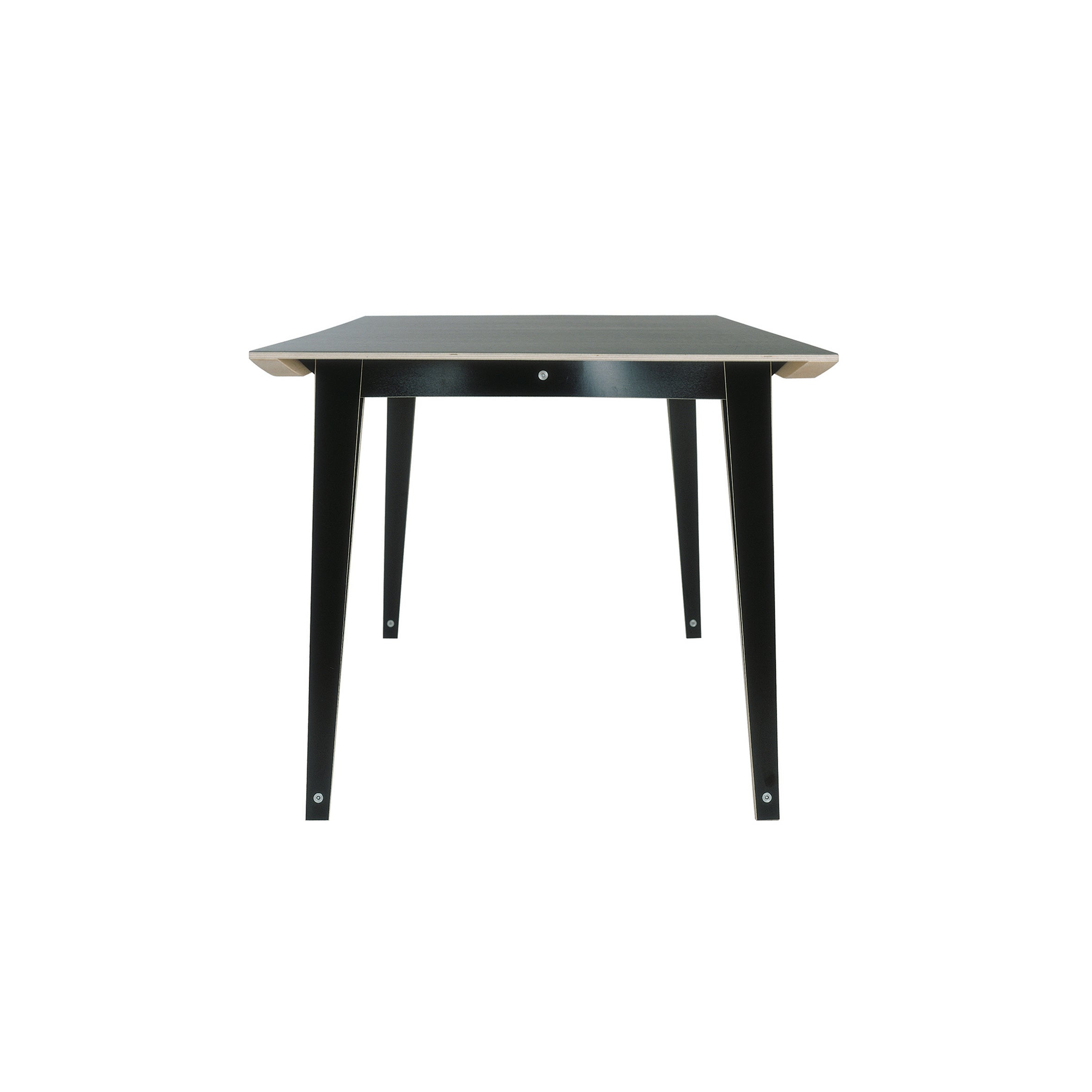 The Spanoto by Moormann is a minimalist rectangular table crafted from birch plywood, viewed from the end, with a sleek black finish and four sturdy legs. It boasts a simple, modern design with a flat top and slightly rounded corners, set against a plain white background.