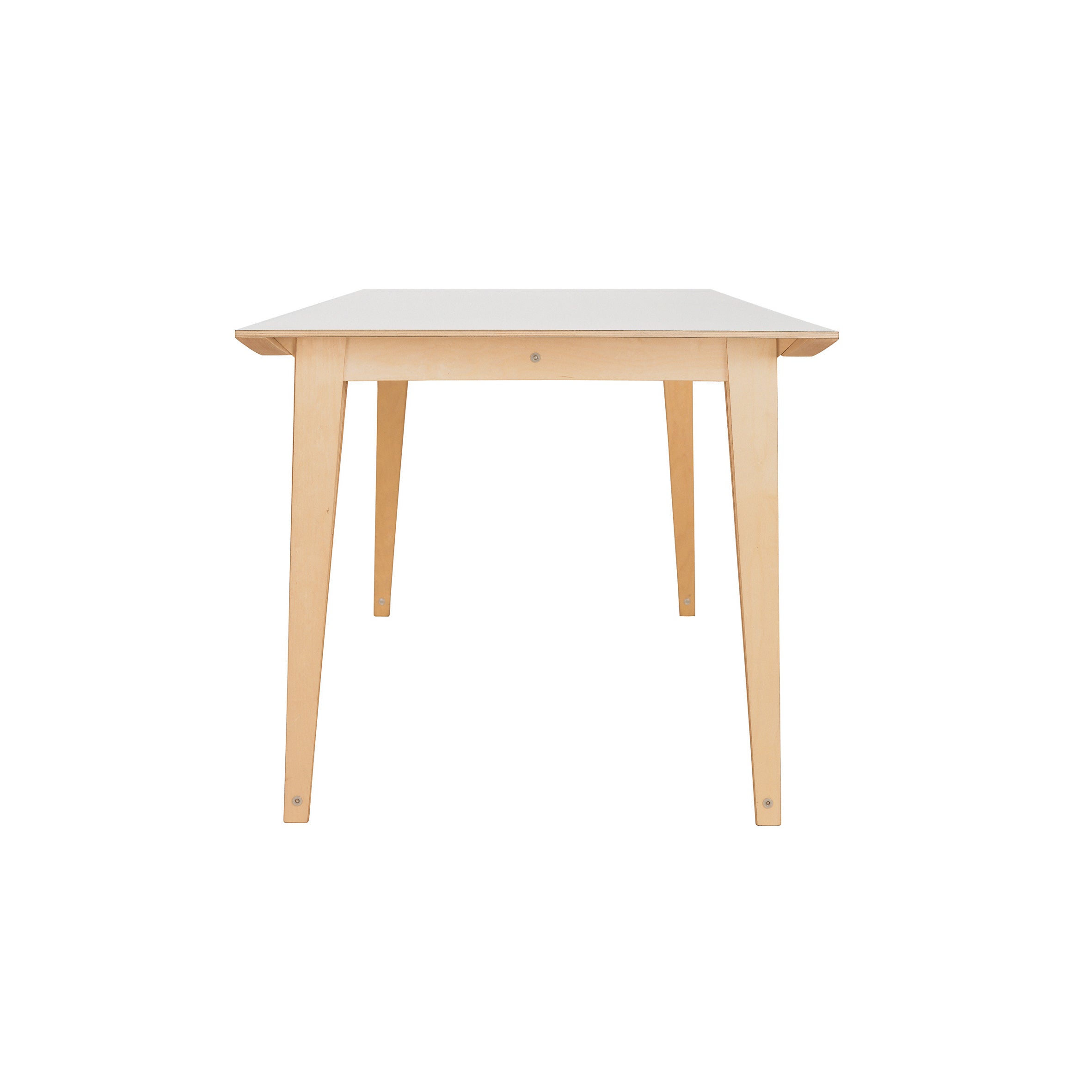 The Spanoto by Moormann is a minimalist, sleek table with a rectangular white birch plywood top and light brown tapered legs. Seen from the narrow side against a plain white background, it elegantly showcases its refined design.