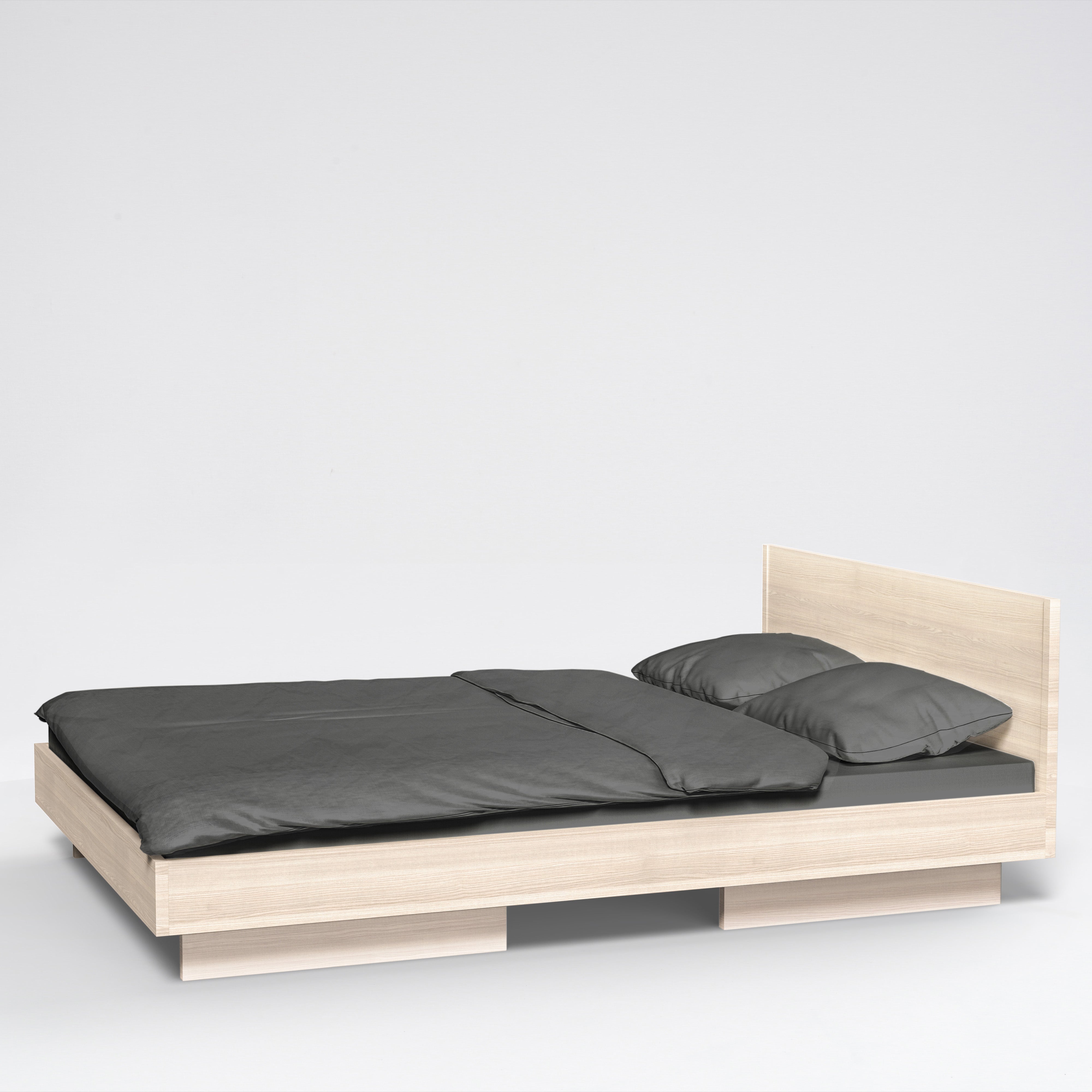 The Zians Bed by Objekte unserer Tage combines dreamy coziness with minimalist design, featuring a light wood frame and dark gray bedding. It includes a simple rectangular headboard against a white background for natural sleeping in style, complete with two matching pillows.