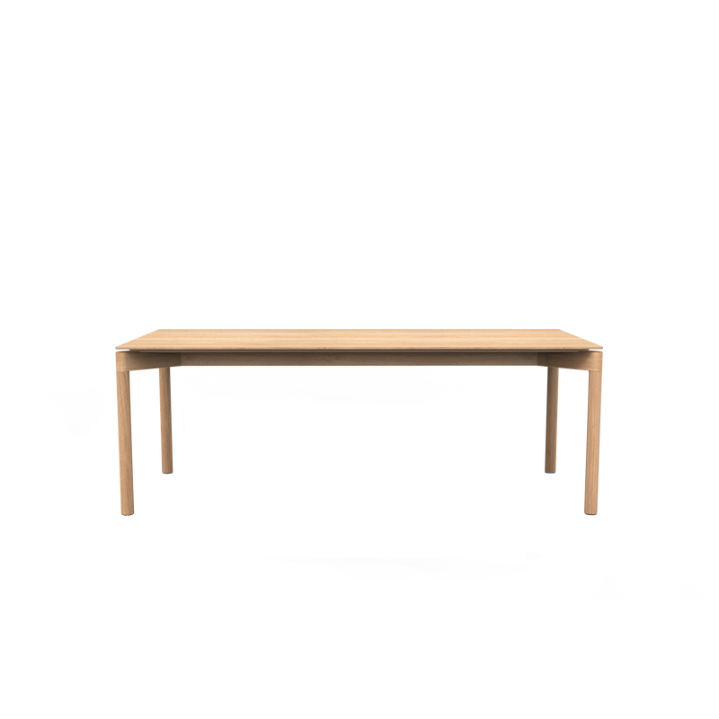 The Wedekind Table by Objekte unserer Tage is a refined piece made from sustainable oak. This rectangular, wooden table with four sturdy legs stands out against a white background, showcasing precision craftsmanship at its finest.