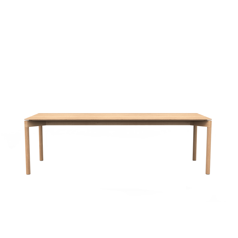 The Wedekind Table by Objekte unserer Tage showcases precision craftsmanship with a minimalist design, clean lines, and a natural finish. Made from sustainable oak wood, it elegantly stands on four straight legs against a plain black background.