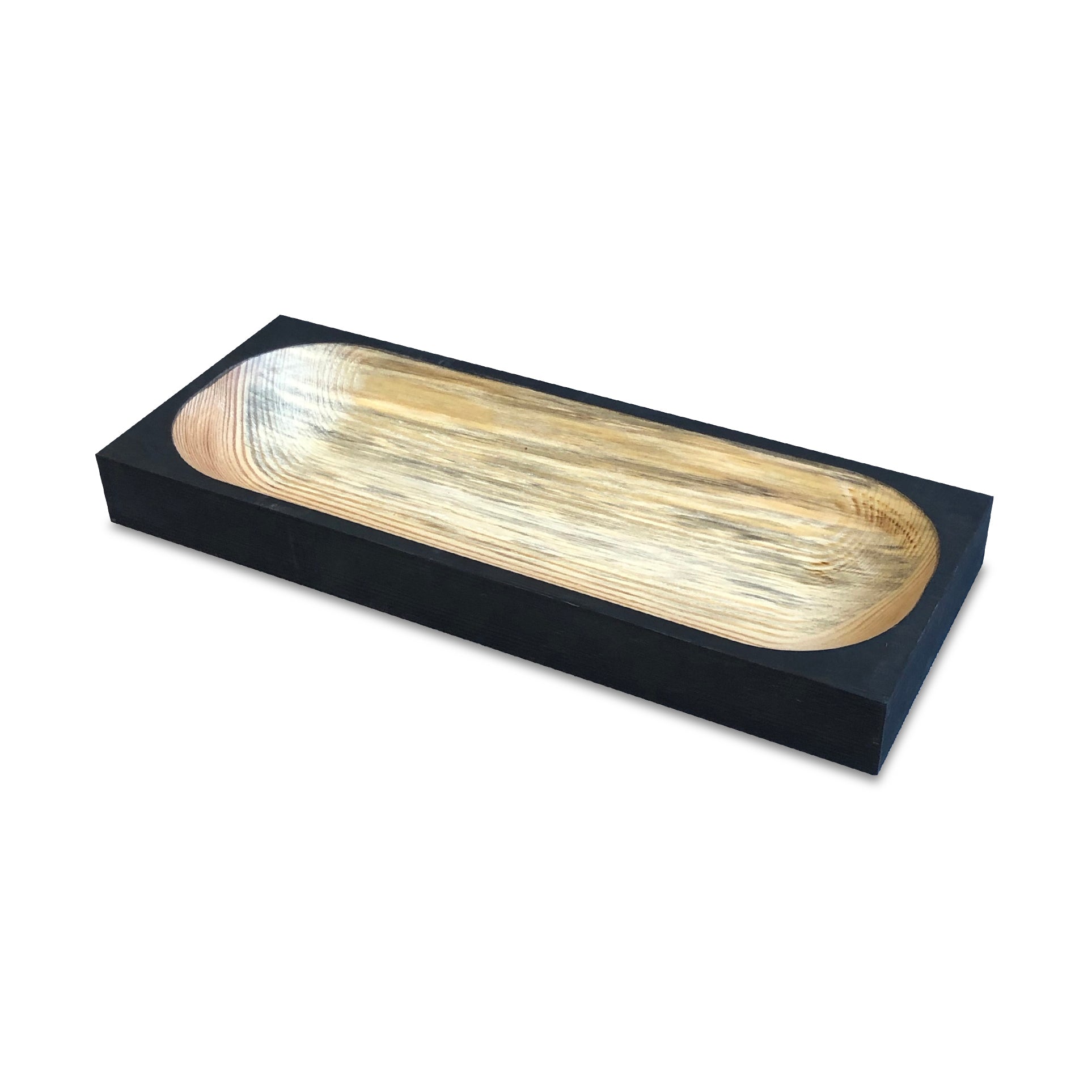 The Cavetto by One For Hundred is a standout rectangular wooden bowl made from pinewood, featuring a smooth light wood interior and dark exterior. Its elongated shape and minimalist design make it an elegant table accessory when displayed on a white surface.