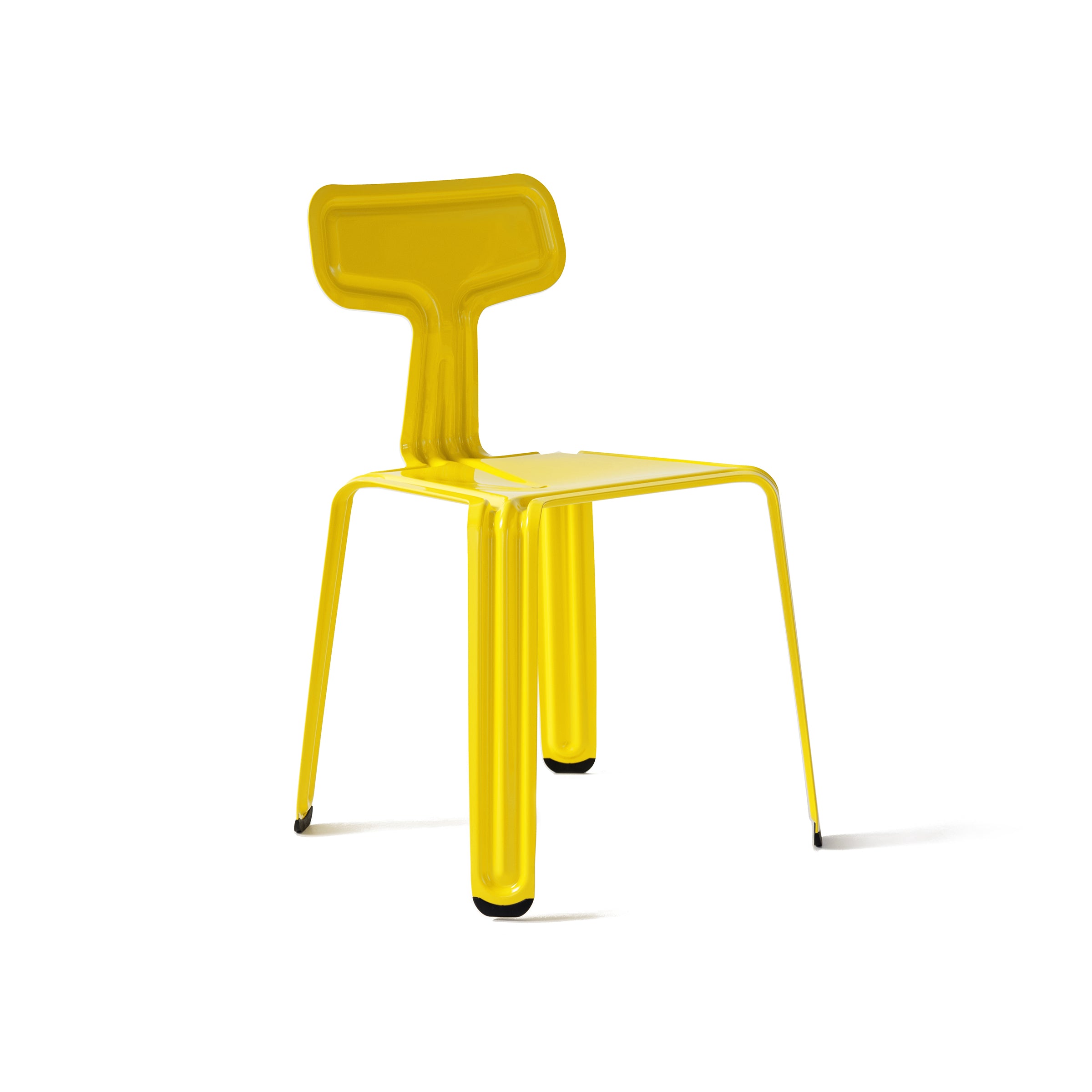 Moormanns Pressed Chair is a yellow modern masterpiece with an angular design, resembling folded metal artistry. Its glossy finish and black leg caps add sophistication, while the stackable feature ensures practicality without sacrificing style.