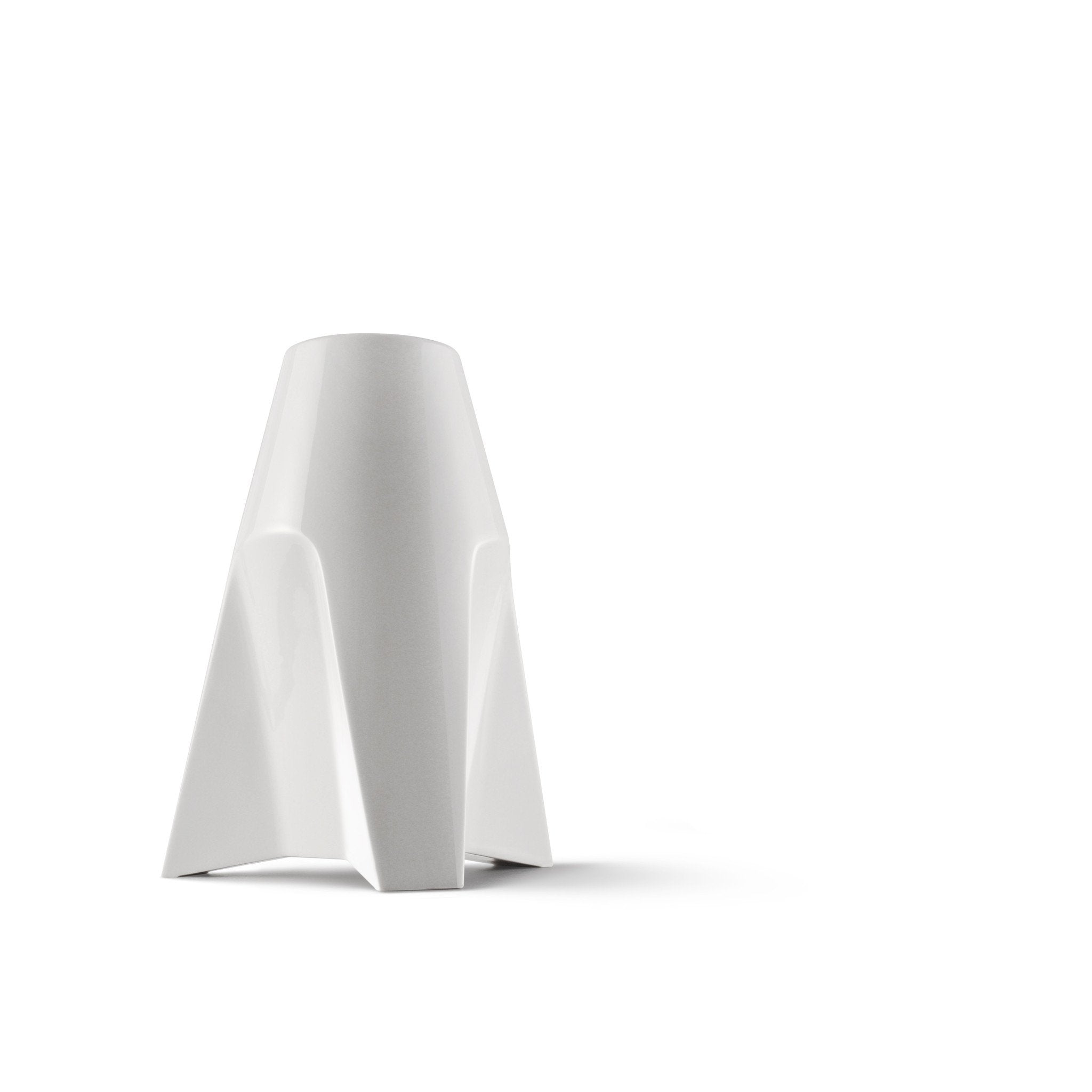 The Augarten Rocket Vase for sale is a modern, white, abstract sculpture reminiscent of a porcelain vase. Inspired by Thomas Feichtners style for the Vienna Porcelain Manufactory, it features smooth, angular planes and curves that create a minimalistic and futuristic appearance.