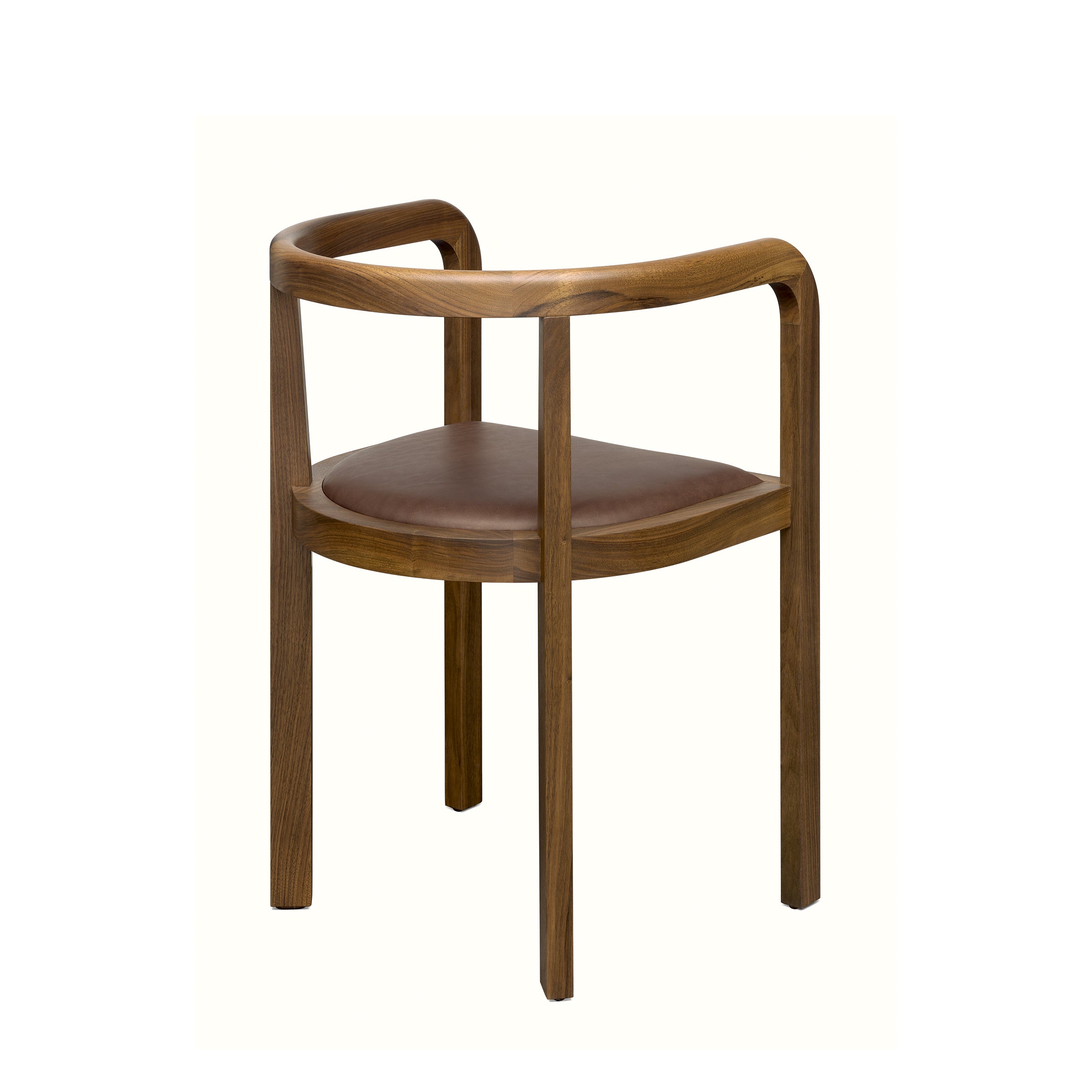 The RH01 Stuttgart chair by E15 exemplifies exceptional solid wood craftsmanship with a sleek, minimalist design. It features a curved backrest, armrests, and a padded dark brown leather seat for comfort. Its warm wood finish pays homage to Richard Herres timeless aesthetic.