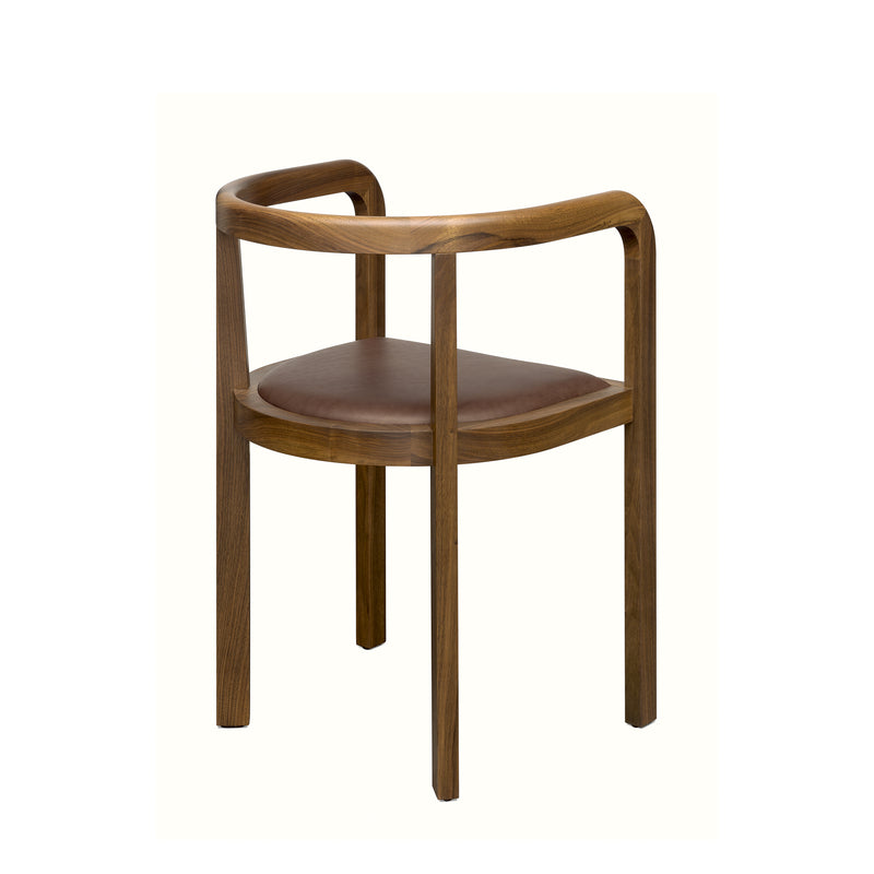 The RH01 Stuttgart chair by E15 exemplifies exceptional solid wood craftsmanship with a sleek, minimalist design. It features a curved backrest, armrests, and a padded dark brown leather seat for comfort. Its warm wood finish pays homage to Richard Herres timeless aesthetic.