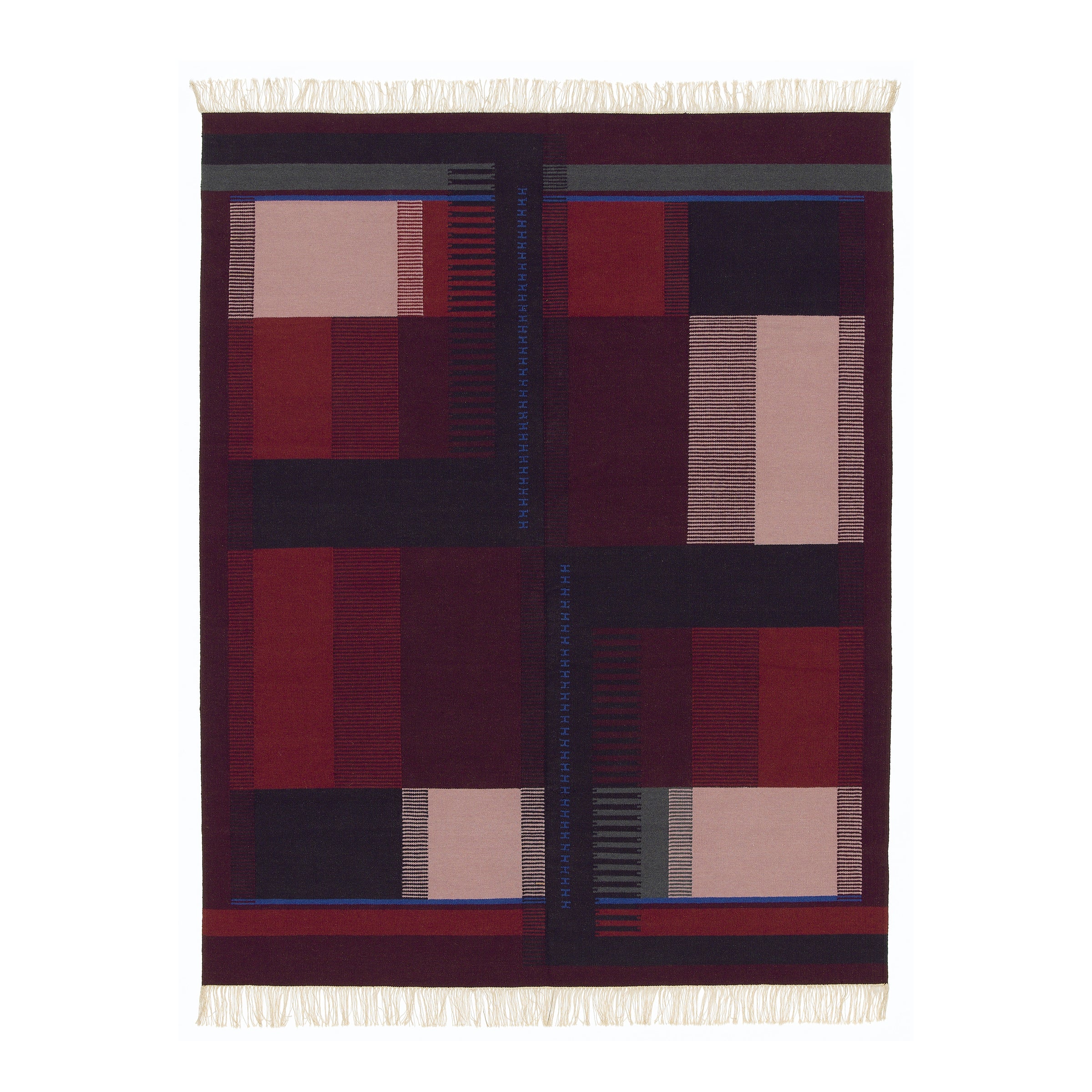 The RH02 Kilim Zet by E15 is a rectangular rug made from hand-spun sheep wool, featuring a geometric pattern with rectangles and stripes in red, pink, and maroon, accented by thin blue and green lines. It is finished with fringe at both ends.