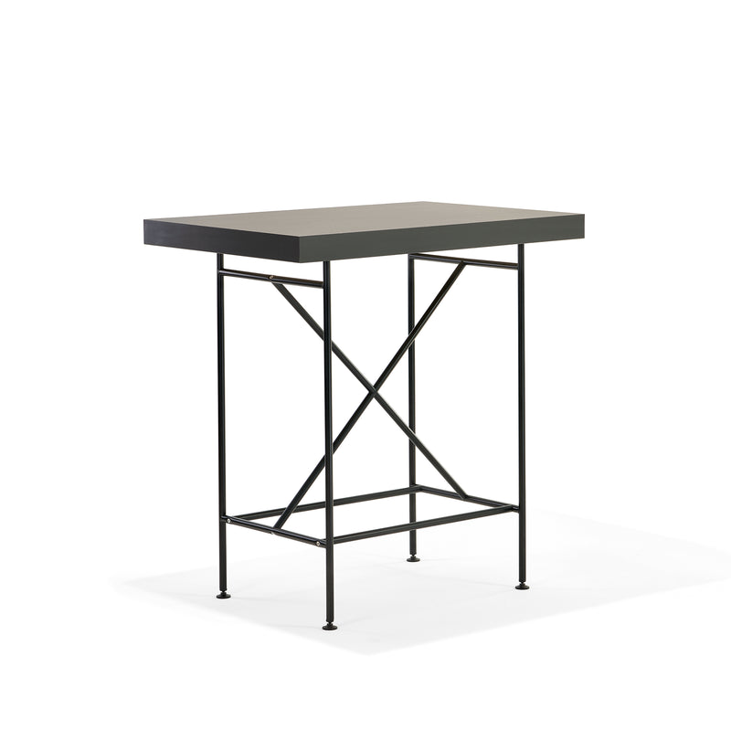 Meet the Milla High Table 1100 by Richard Lampert: a sleek, modern bar-height table featuring a rectangular dark wooden top and slender black metal legs with crossbars for stability. Its elegant design perfectly combines functionality with style against a plain white backdrop.