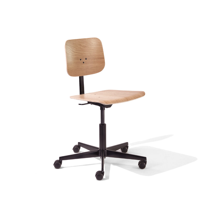 The Mr. Square Task Chair by Richard Lampert is a light wood designer chair with a minimalist design, featuring a flat rectangular backrest and seat for superior comfort. It includes height adjustment and rests on a black swivel base with five rolling wheels, all set against a plain white background.
