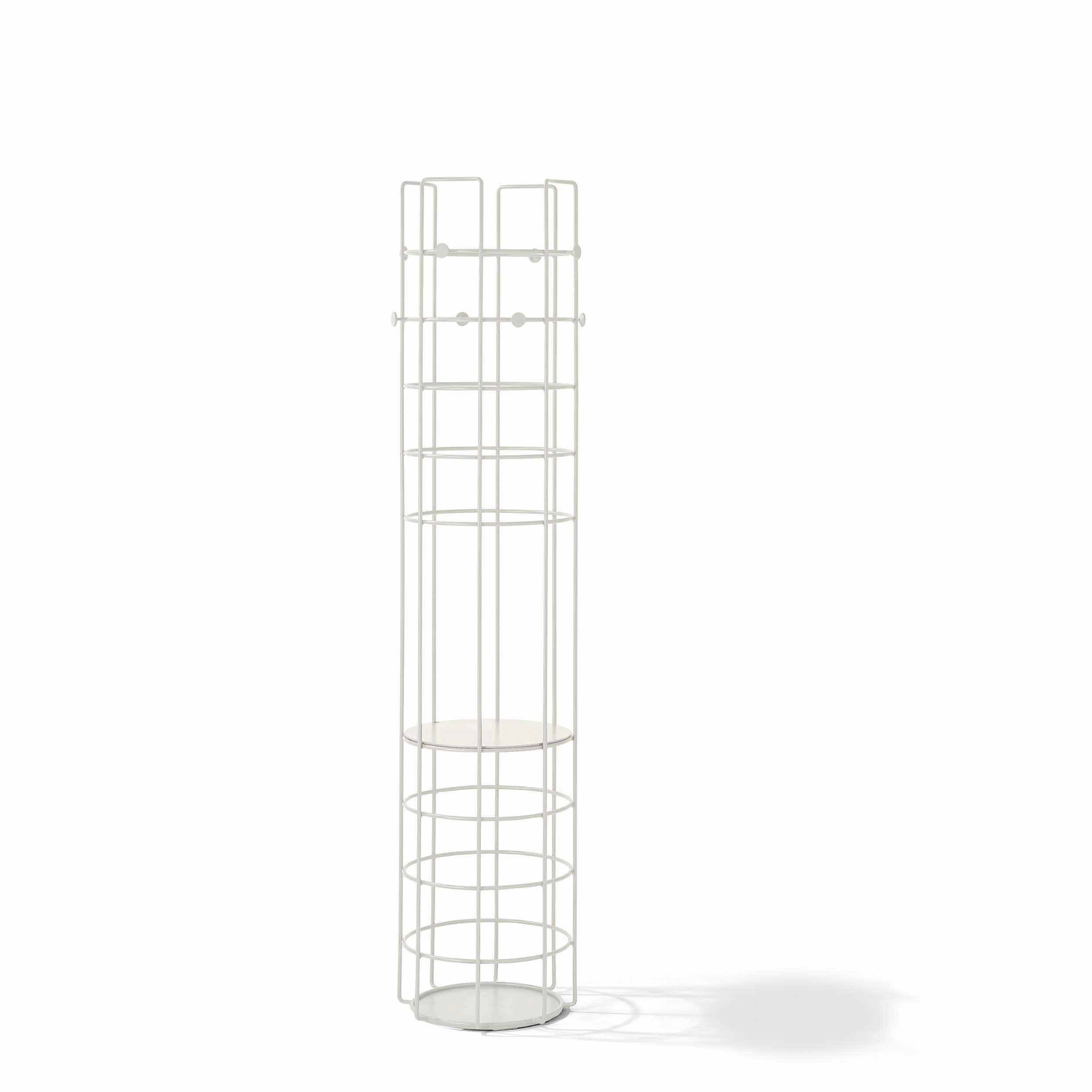 The Bazar Coat Stand by Richard Lampert is a tall, cylindrical white metal umbrella holder with a minimalistic wireframe design, featuring a base and a small circular shelf near the top. It casts a faint shadow on a white background and seamlessly complements any storage solution.