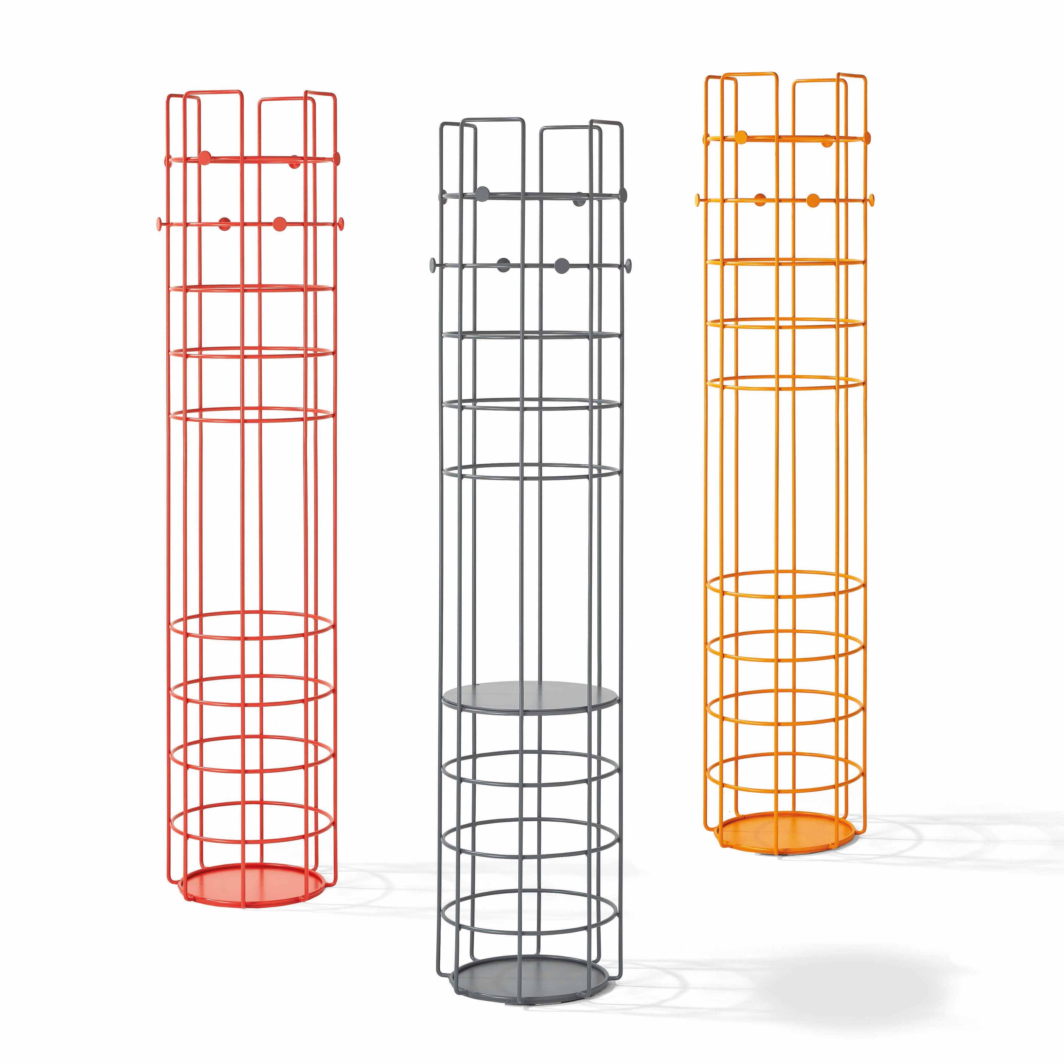 Three Richard Lampert Bazar coat stands in red, gray, and orange stand upright against a white background, featuring cylindrical wire frames with multiple horizontal bars and hooks for ample storage.