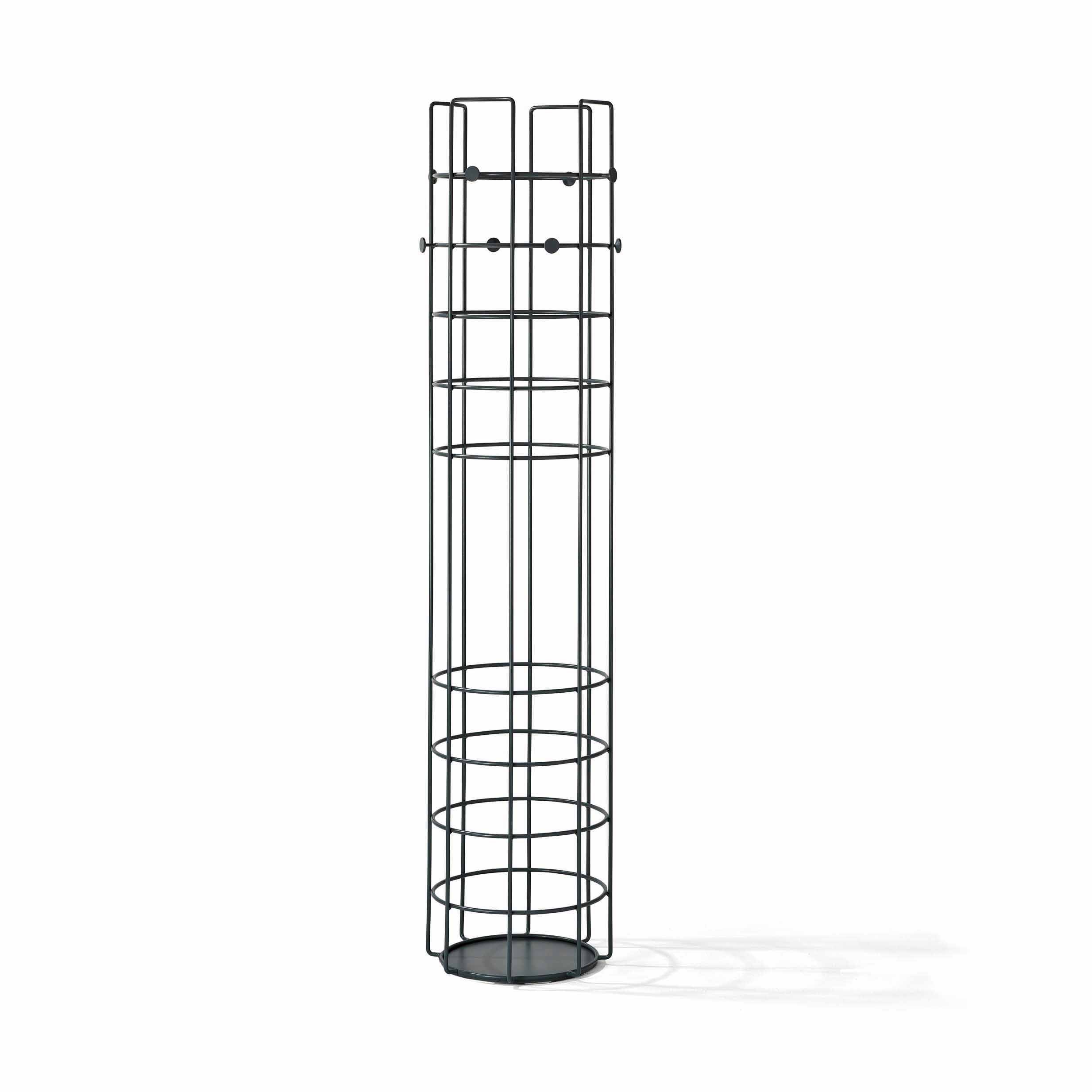 The Bazar Coat Stand by Richard Lampert is a tall, cylindrical metal rack with a black finish that serves as both storage and coat holder. Its frame features vertical and circular bars creating open sections and stands on a small round base, adding elegance to any space.