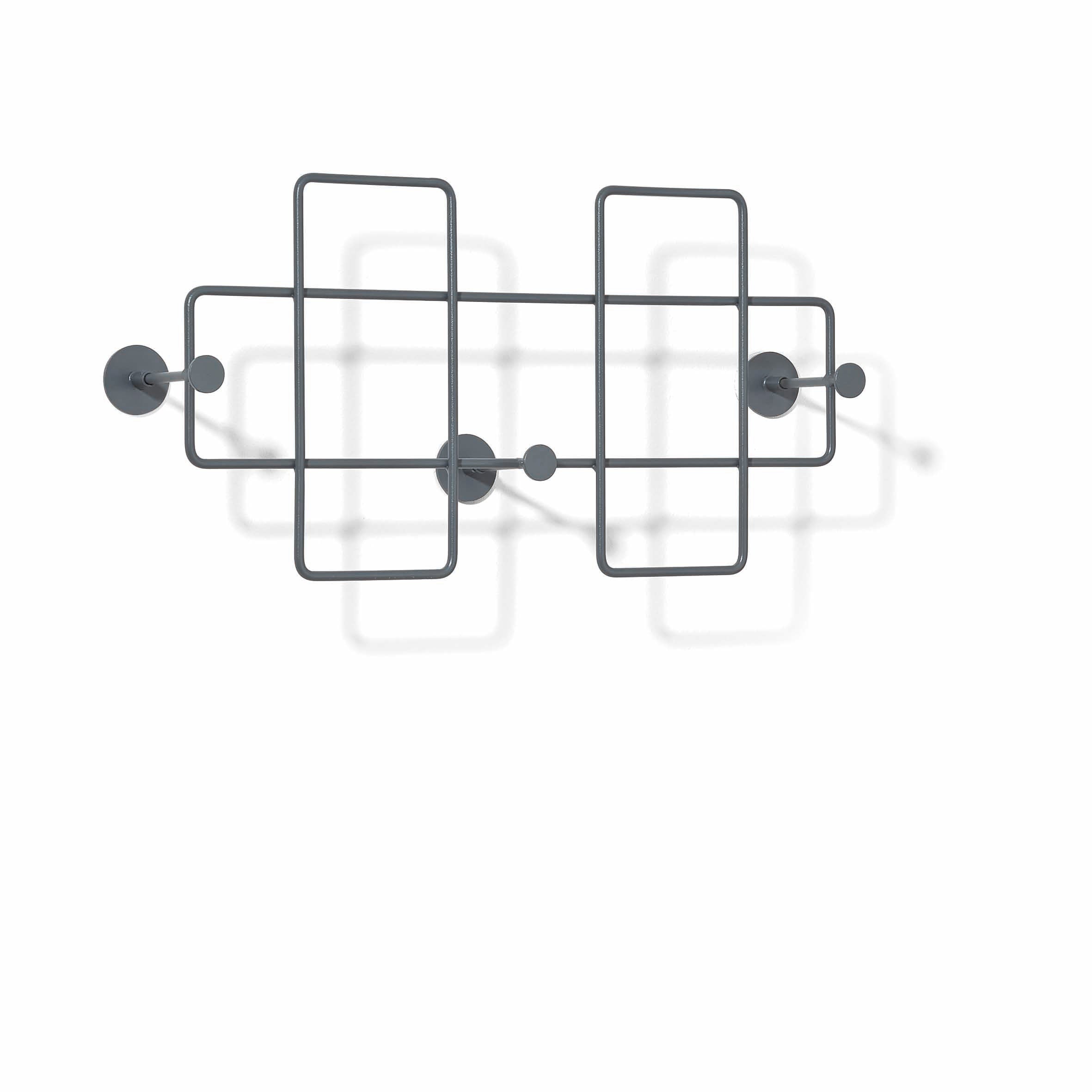 The Bazar Coat Rack by Richard Lampert is a minimalist, wall-mounted organizer featuring an abstract geometric design with rectangular shapes and round hangers. Built from dark, steel powder-coated metal, it casts artistic shadows on white walls, enhancing home organization with style.