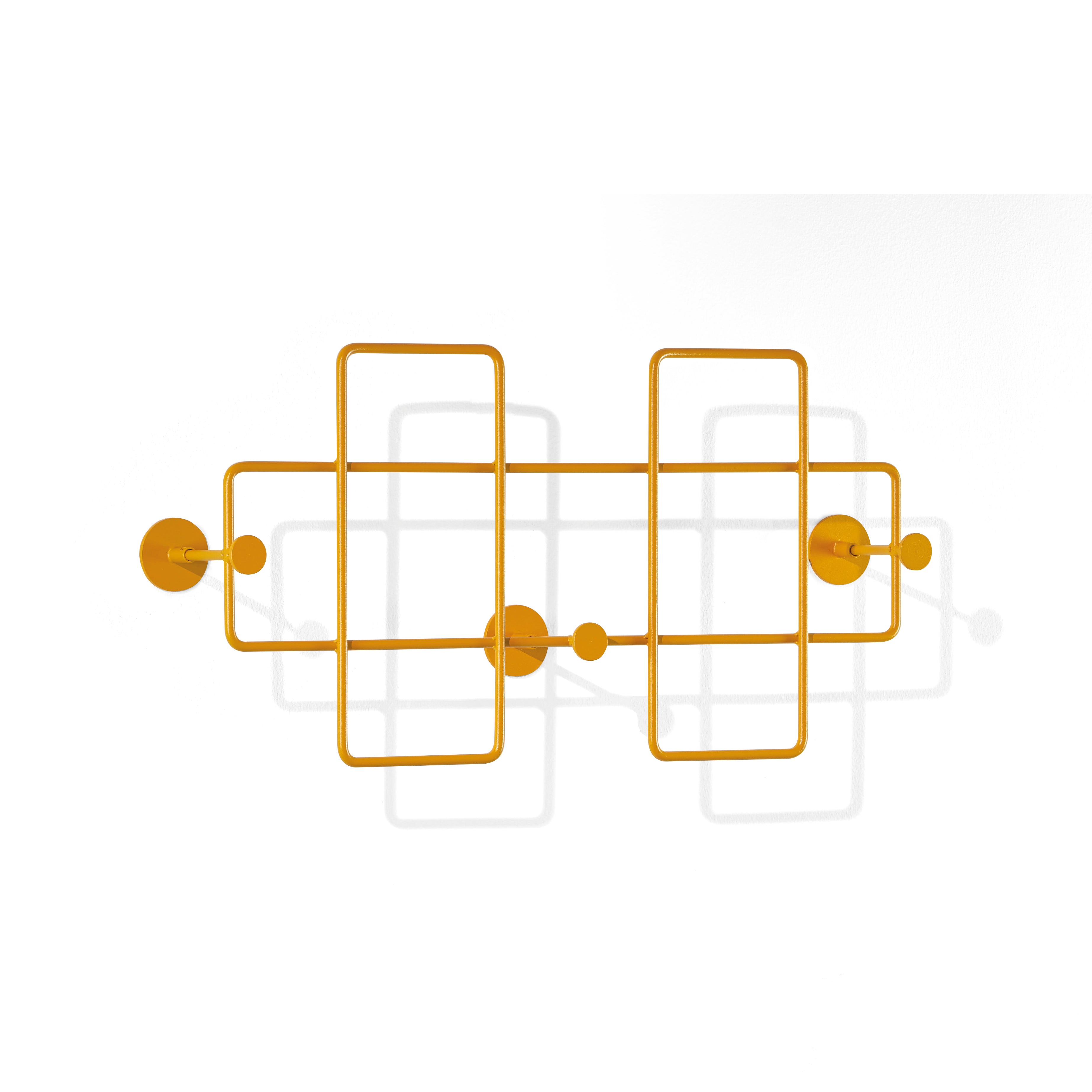Richard Lamperts Bazar Coat Rack is a modern wall decoration of interconnected yellow metal rods, powder-coated in steel, forming rectangles with circular nodes. This wall-mounted artwork doubles as an elegant coat rack and casts soft shadows against a white backdrop for stylish home organization.