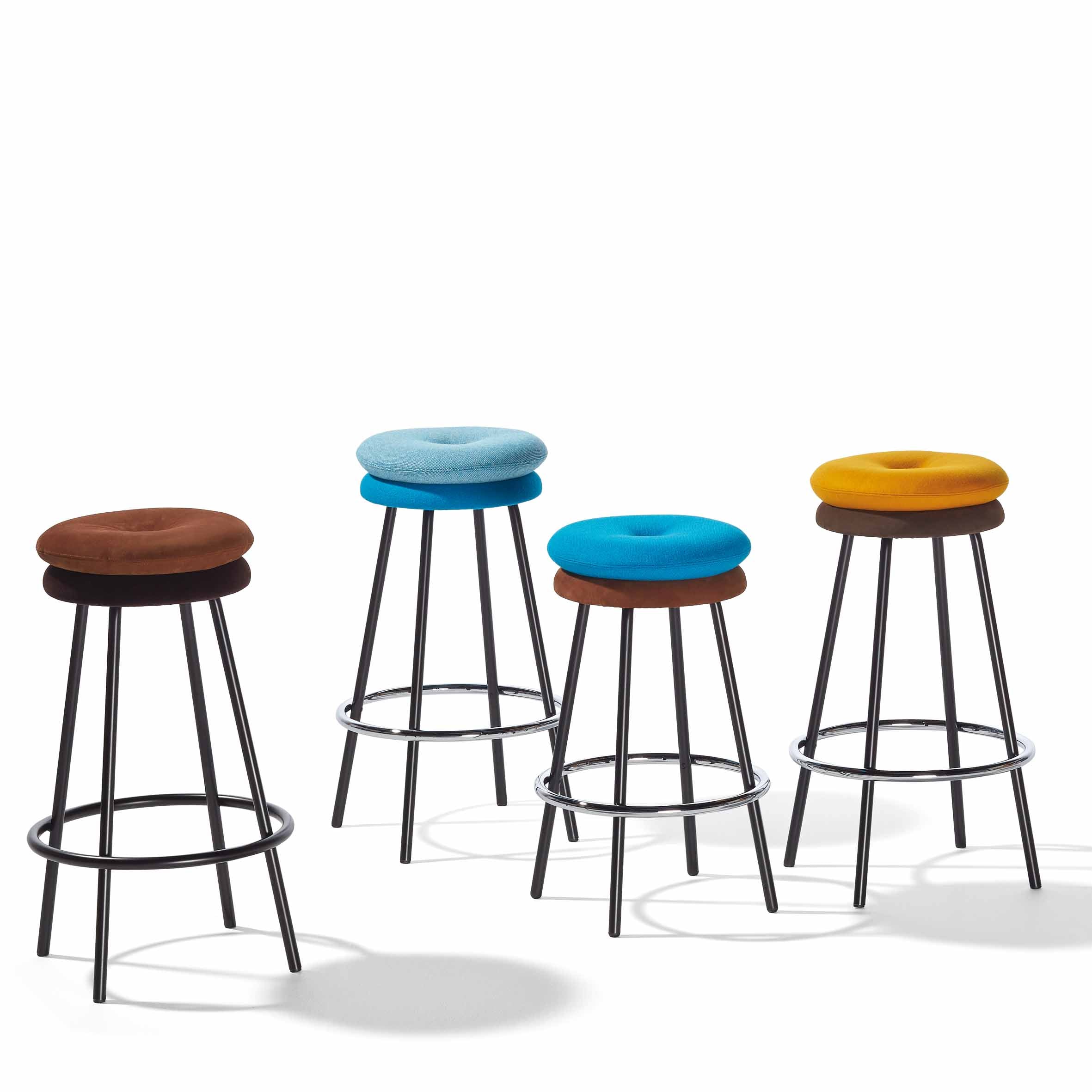 The Richard Lampert Big Tom Barstool collection offers four modern bar stools featuring tubular steel frames and vibrant leather and textile covers. Cushions in brown, light blue, deep blue, and yellow provide a stylish pop of color to any space.