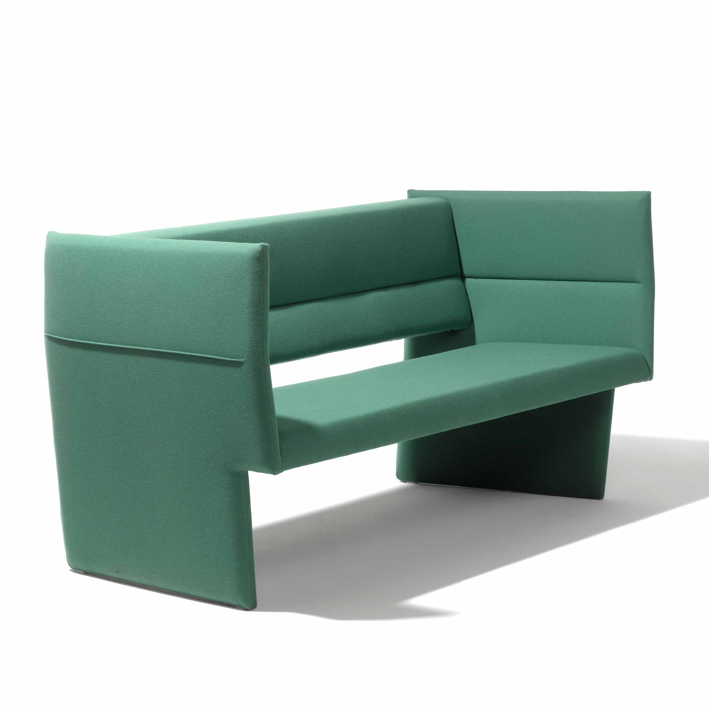 The Cup Sofa by Richard Lampert is a modern green bench with high back and sides, featuring clean lines, an angular avant-garde design, high-end upholstery, and a solid wood frame on each end.