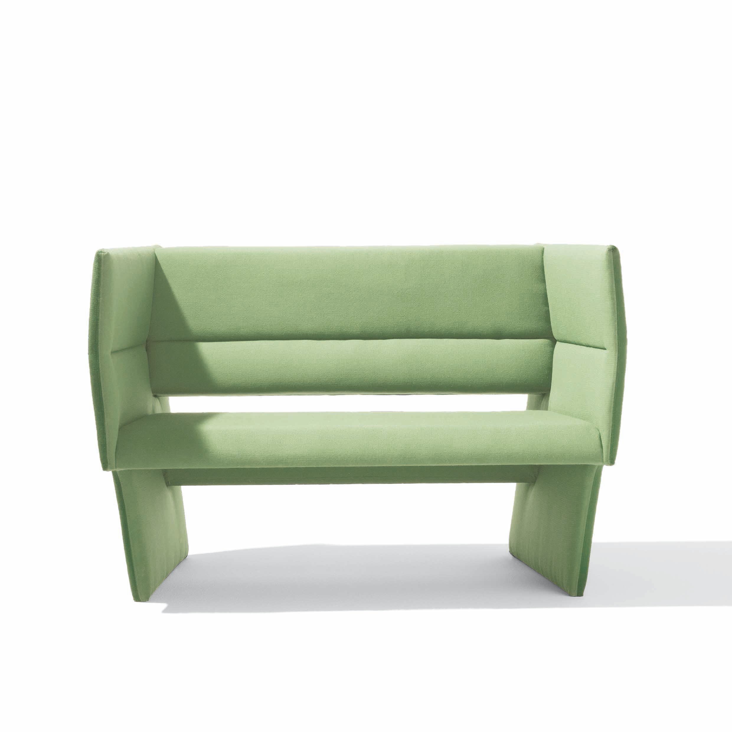 The Cup Sofa by Richard Lampert, a modern angular green bench with avant-garde design, features cushioned seating. Set against a white background, its geometric structure is highlighted and enhanced by high-end upholstery for added texture. Available for sale.
