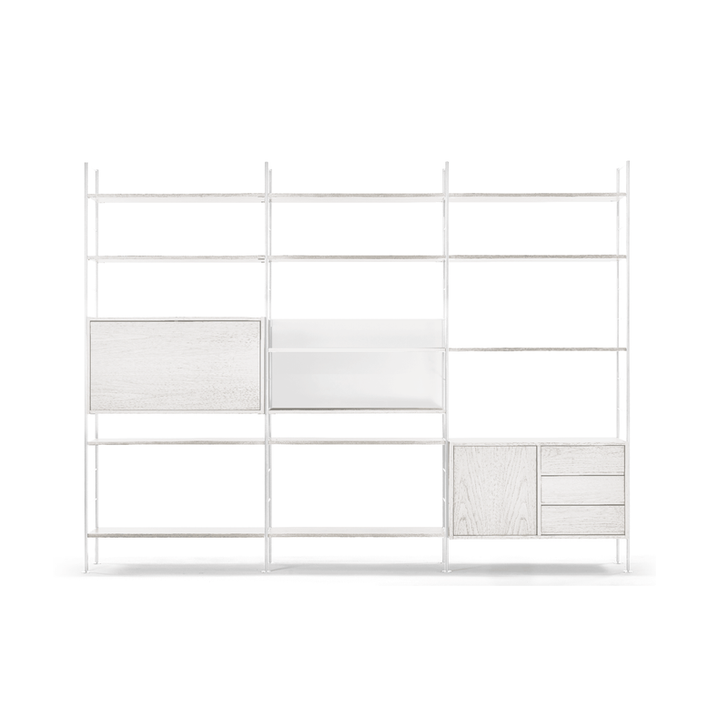 The DHS10 Shelf by Richard Lampert is a minimalist white unit with open shelves and closed compartments of various sizes, showcasing German industrial design in a clean, modern style perfect for organizing and displaying items.