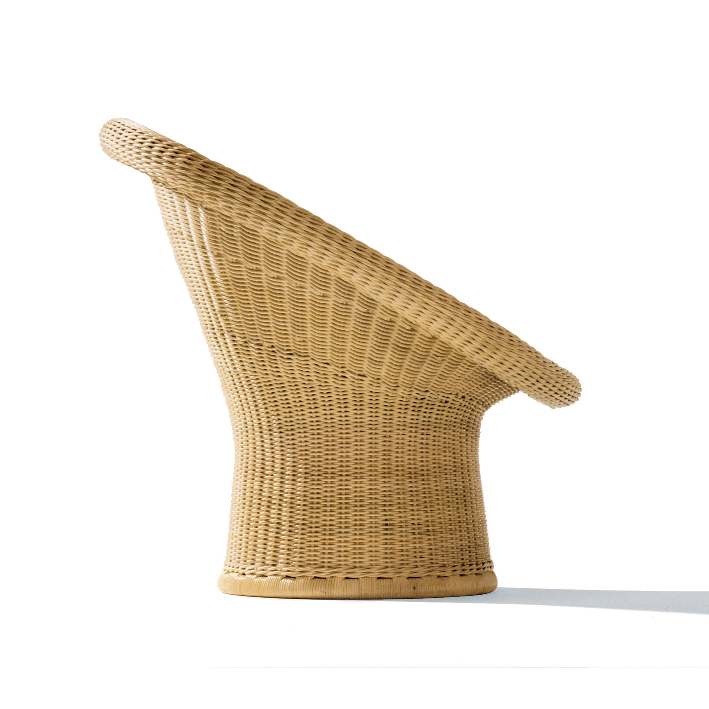 Side view of the E10 Lounge Chair by Richard Lampert, featuring a rattan design with a wide, flared circular backrest and a tapered base, reminiscent of Egon Eiermanns style, set against a plain white background.