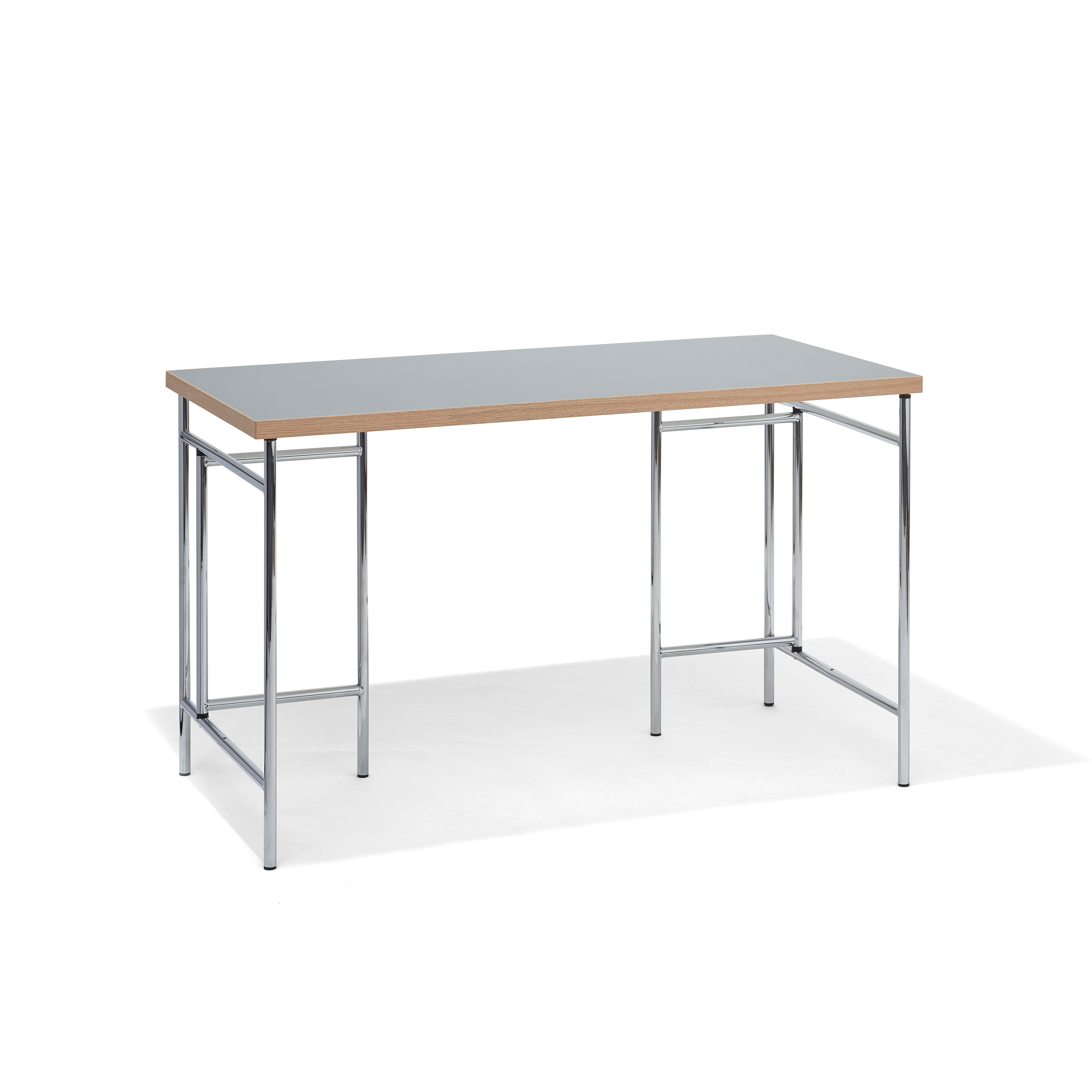 The Richard Lampert Eiermann 3 Table features a minimalist design with a light wooden tabletop and chrome metal legs. Its rectangular shape and open frame make it perfect for sleek, modern workspaces, all set against a plain white background.