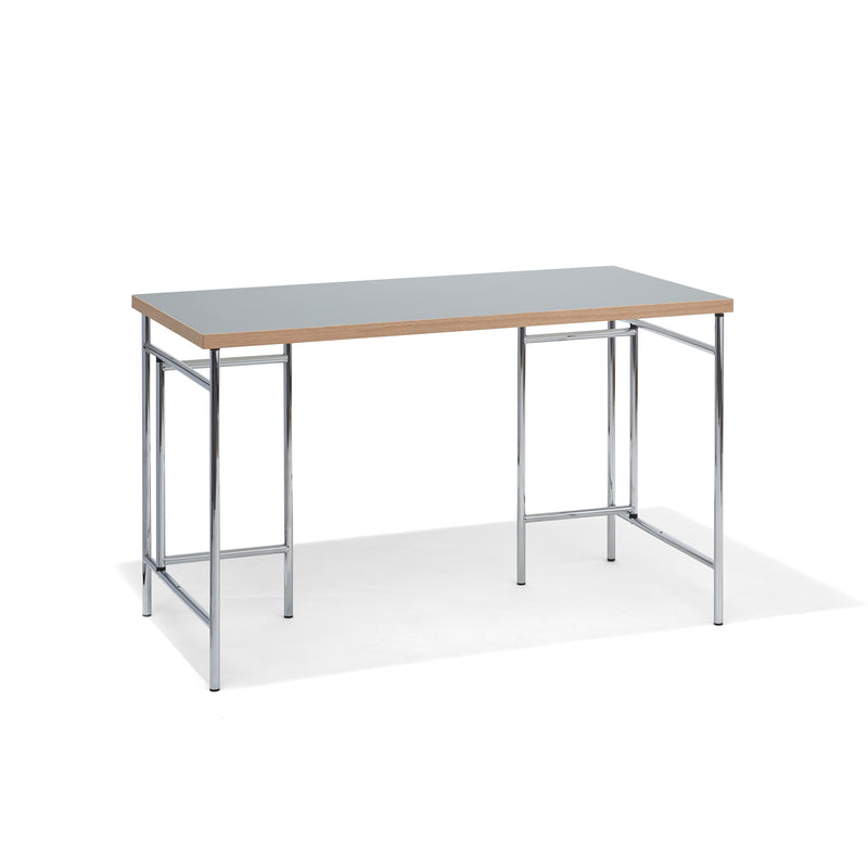 The Richard Lampert Eiermann 3 Table features a minimalist design with a light wooden tabletop and chrome metal legs. Its rectangular shape and open frame make it perfect for sleek, modern workspaces, all set against a plain white background.