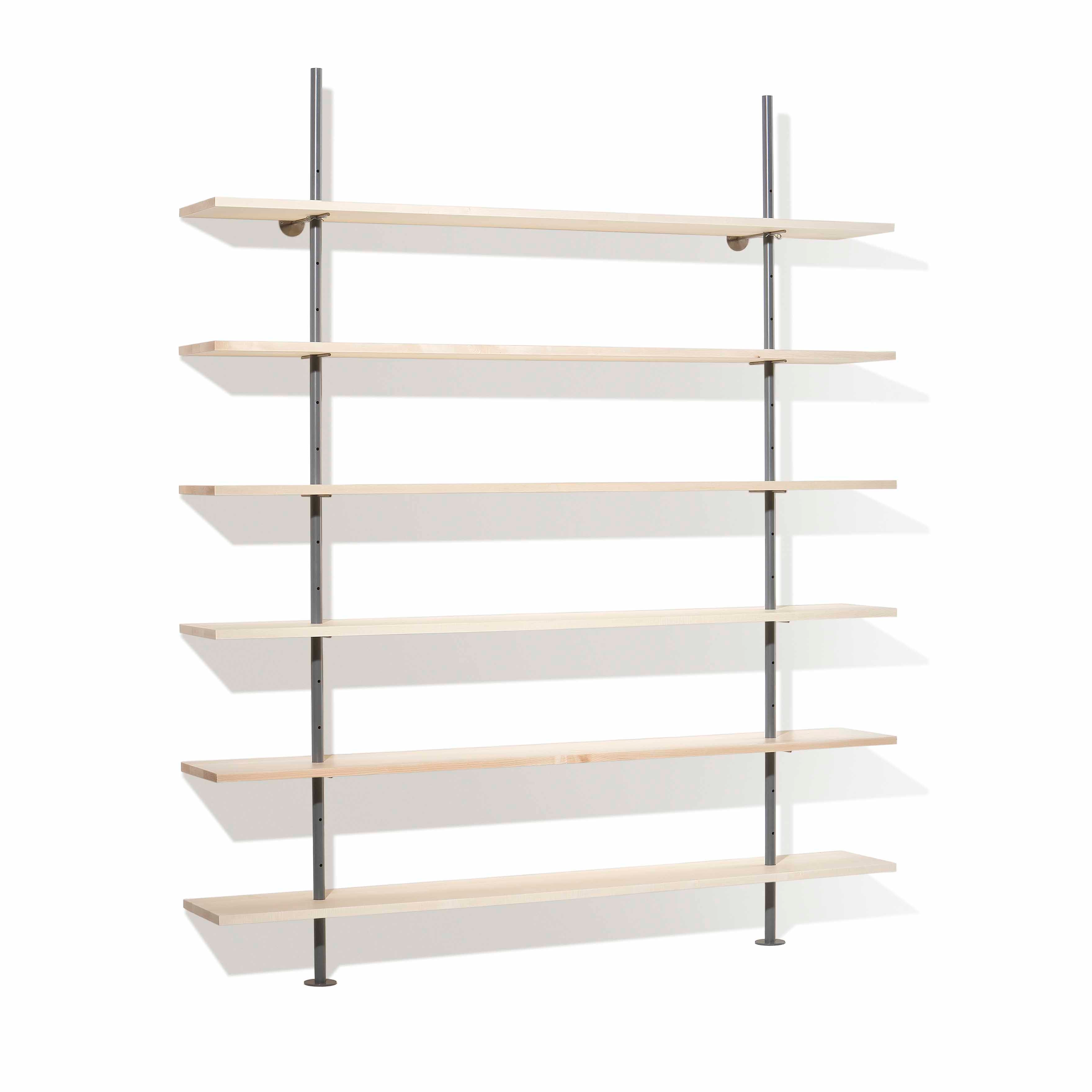 The Eiermann Shelf by Richard Lampert is a minimalist wall-mounted unit with seven evenly spaced wooden shelves supported by vertical metal brackets against a white backdrop.