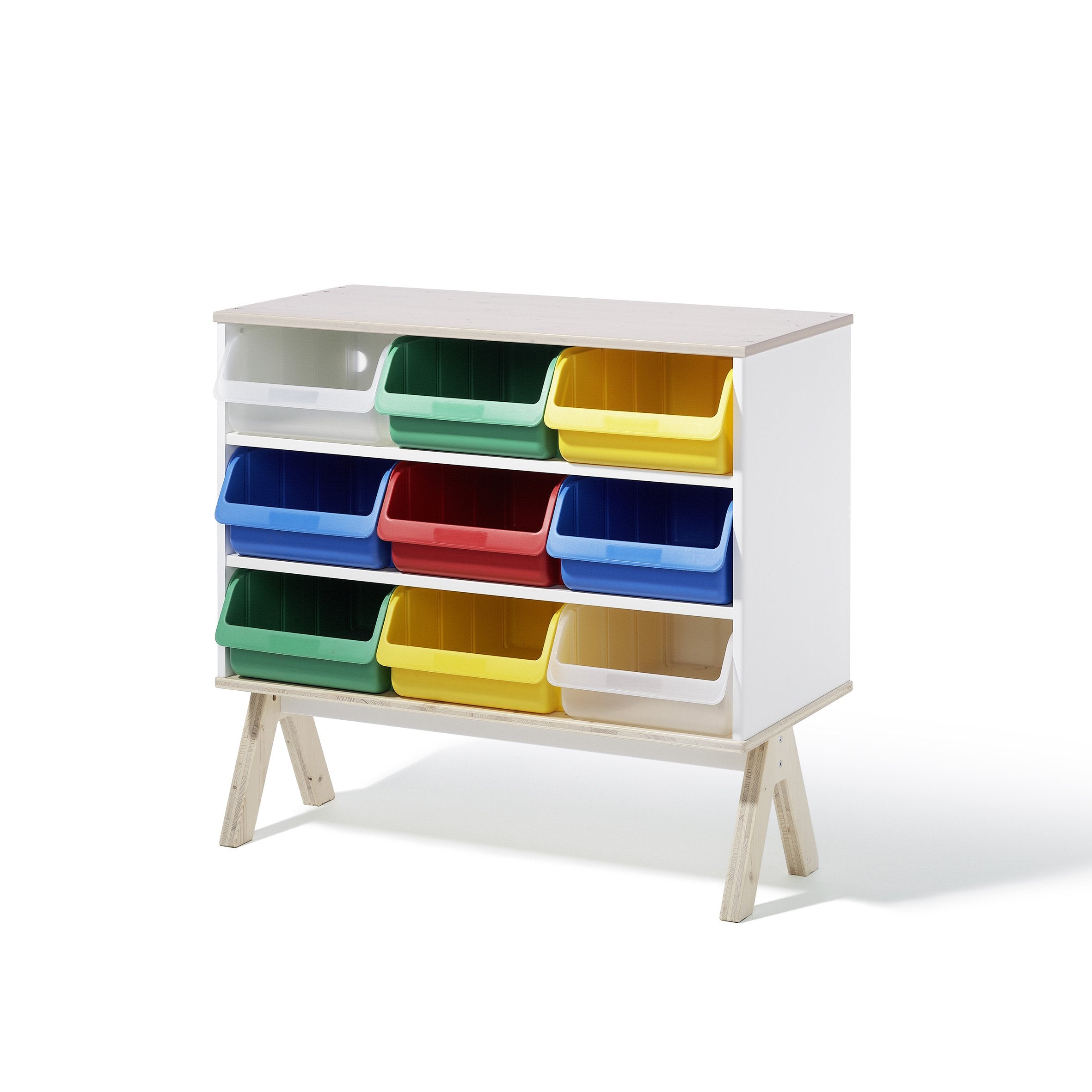 The Famille Garage - Storage by Richard Lampert is a white furniture system with nine colorful plastic bins in red, yellow, green, and blue. It features light wood legs and three rows for ample organization.