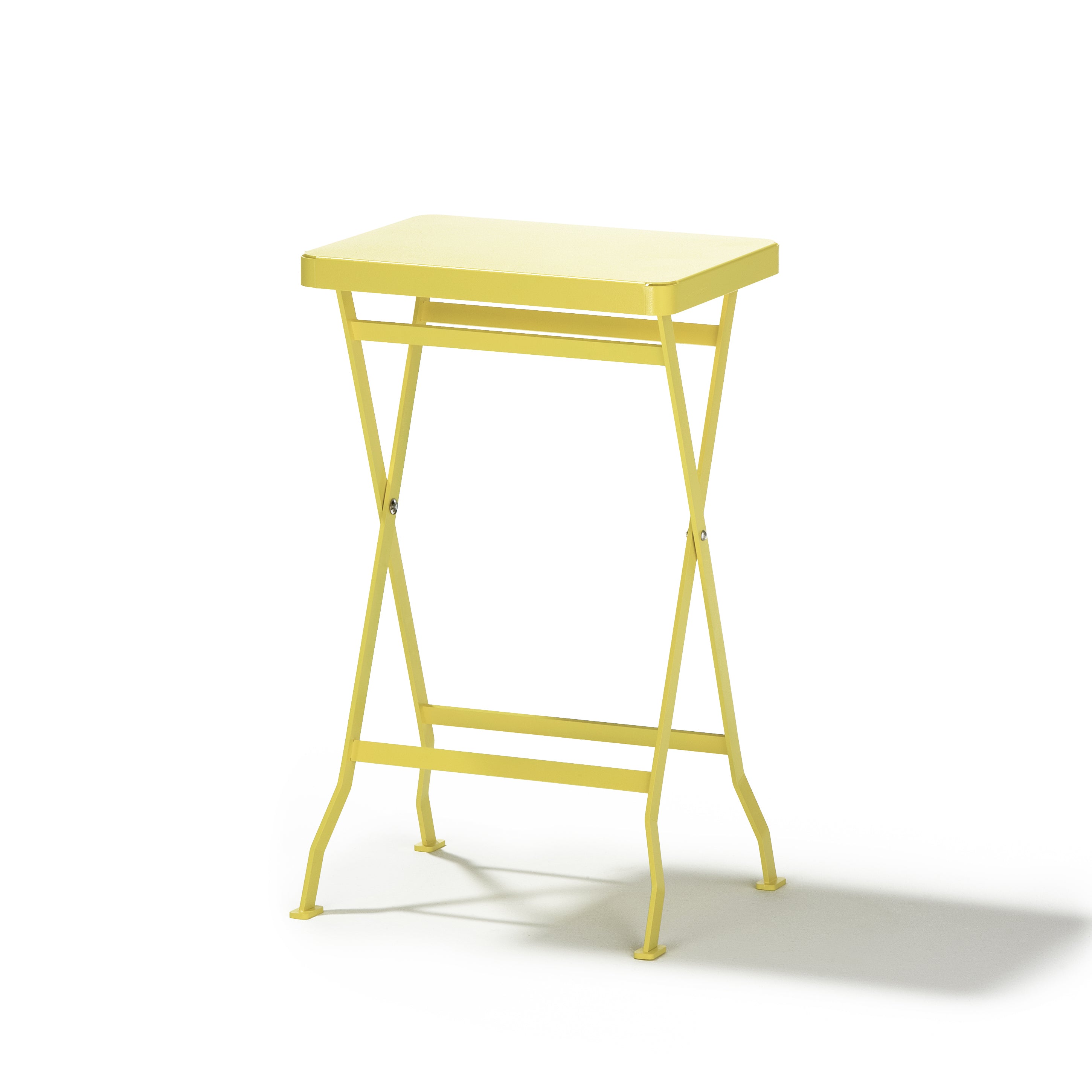 The Flip Side Table by Richard Lampert is a small yellow premium folding table featuring a rectangular top and crossed legs, set against a plain white background.