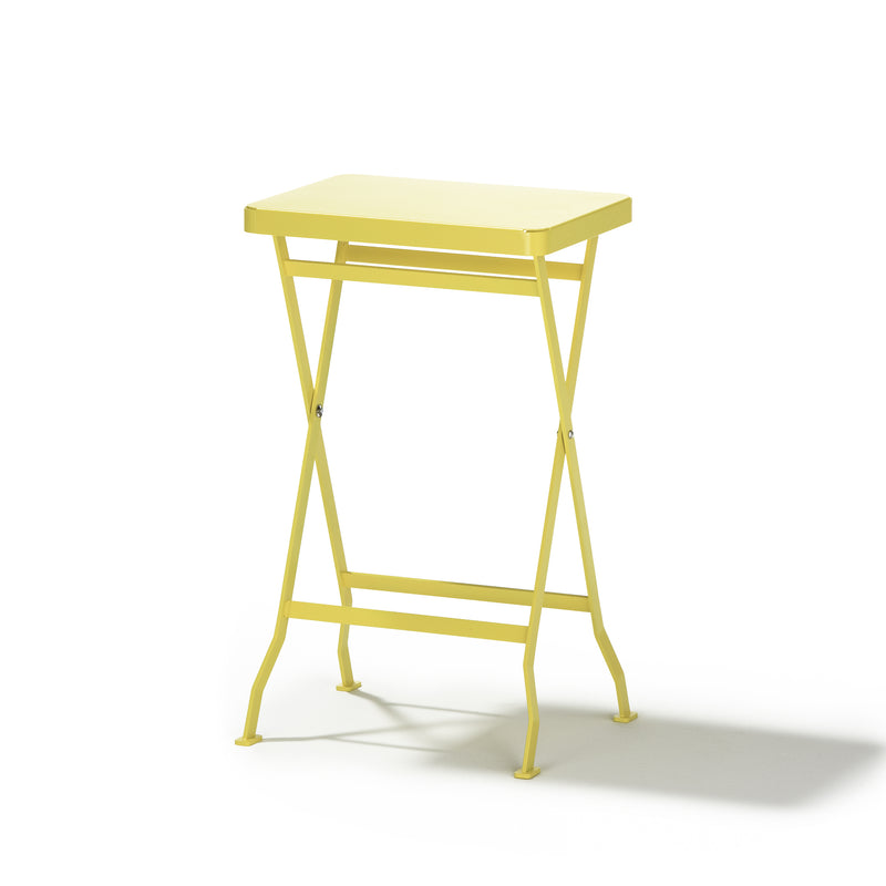 The Flip Side Table by Richard Lampert is a small yellow premium folding table featuring a rectangular top and crossed legs, set against a plain white background.