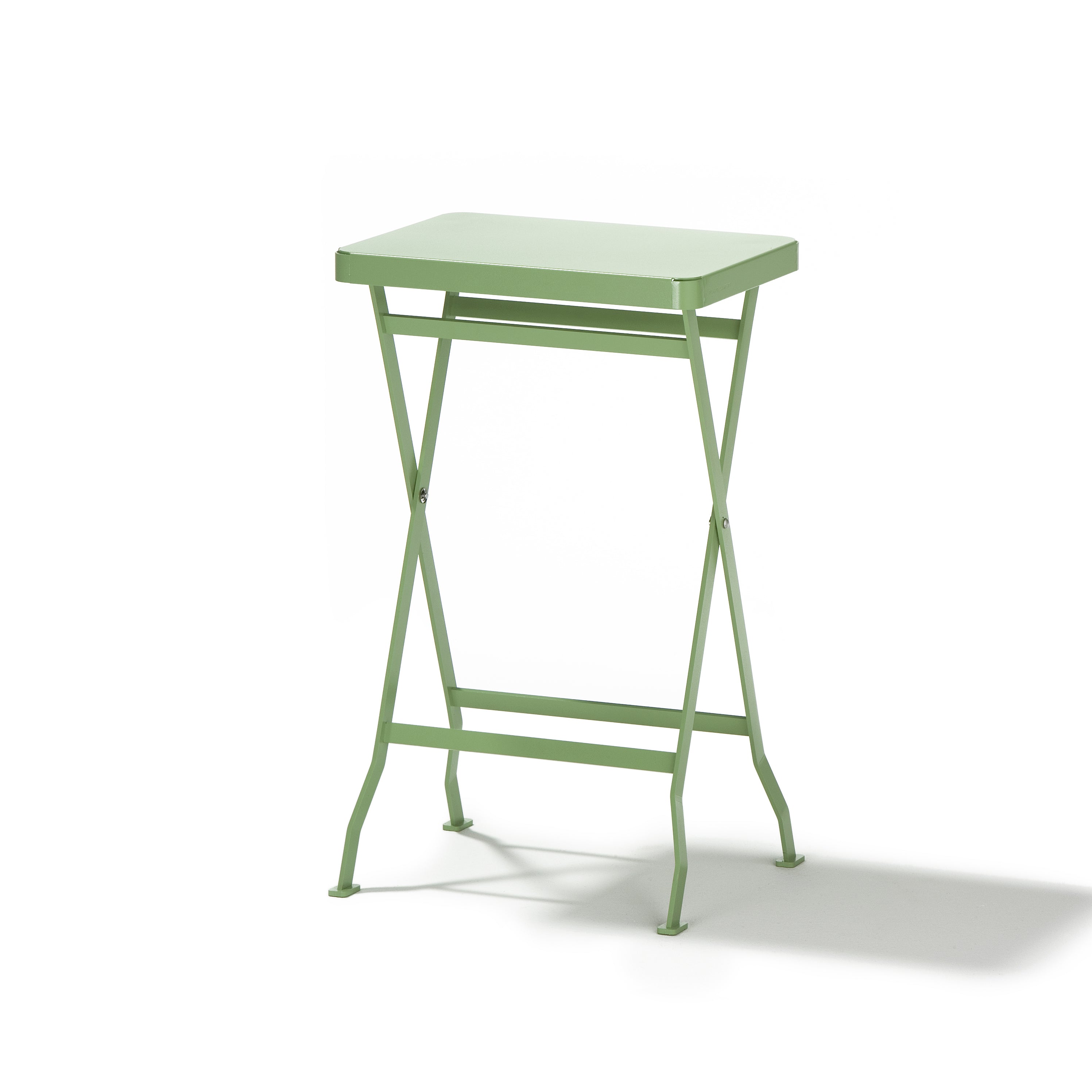 The Richard Lampert Flip Side Table is a premium quality, light green folding table with a sleek rectangular top and slim, crossed stainless steel legs set against a plain white background.