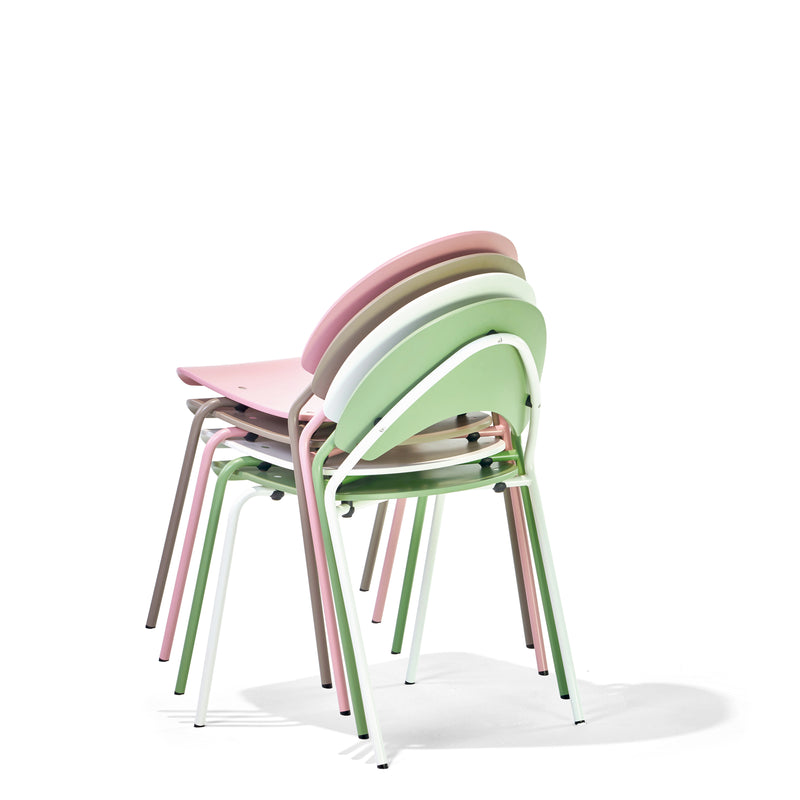 Four pastel-colored Frog Chairs by Richard Lampert, featuring stackable designs and metal legs, are elegantly arranged on a white background. Reminiscent of Herbert Hirches style, the chairs showcase shades of green, pink, purple, and beige.