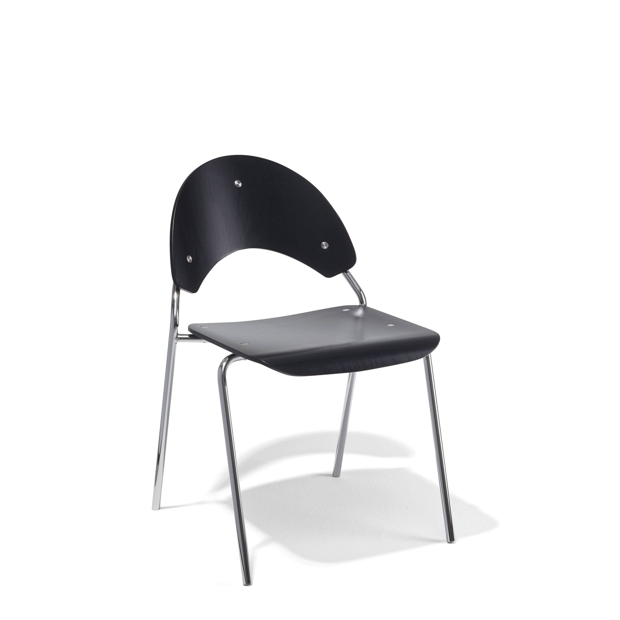 The Frog Chair by Richard Lampert showcases a minimalist design with a sleek black seat and backrest, supported by a shiny chrome four-legged frame. Designed by Herbert Hirche, this stackable chair exemplifies form meeting function against a stark white background.