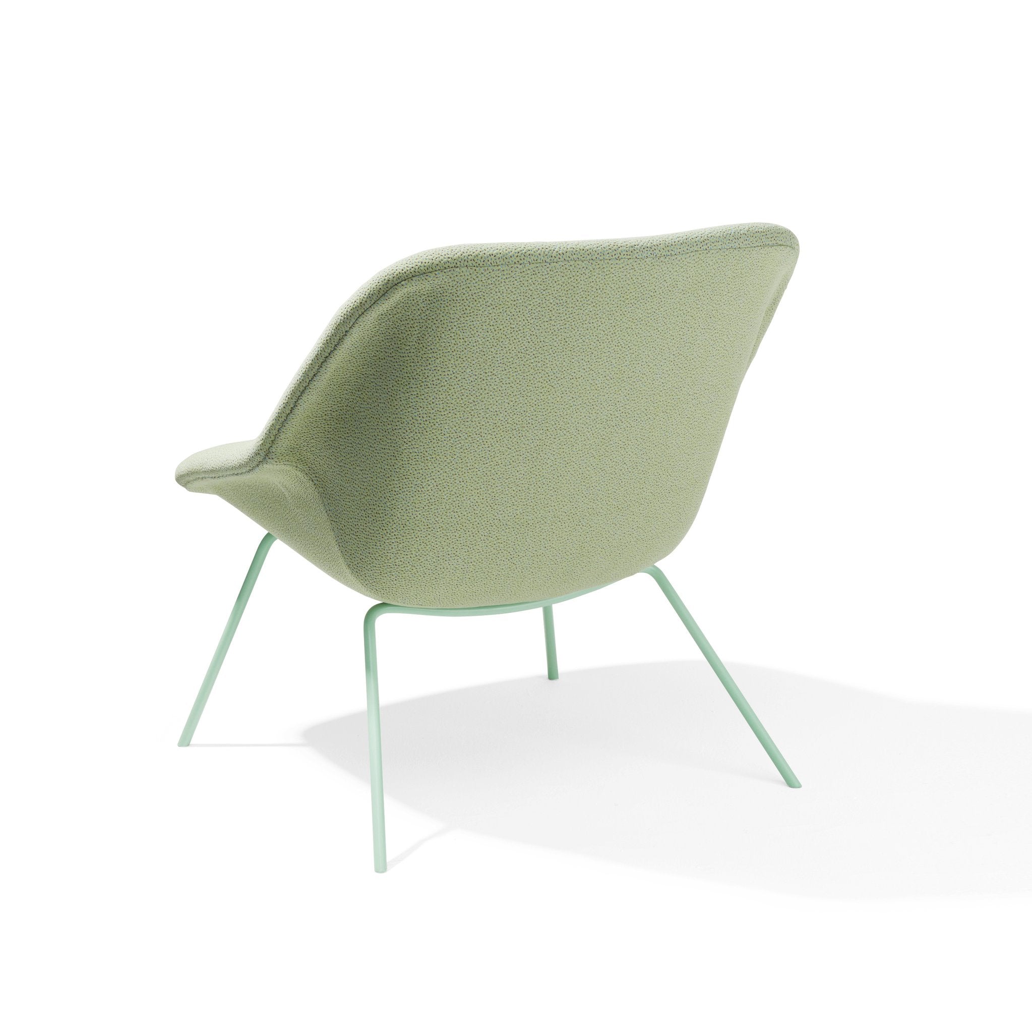 The H 55 Lounge Chair by Richard Lampert is a modern green fabric lounge chair inspired by Herbert Hirches aesthetics, featuring a curved backrest, minimalist design with slender metal legs, and a tubular steel frame on a white background.