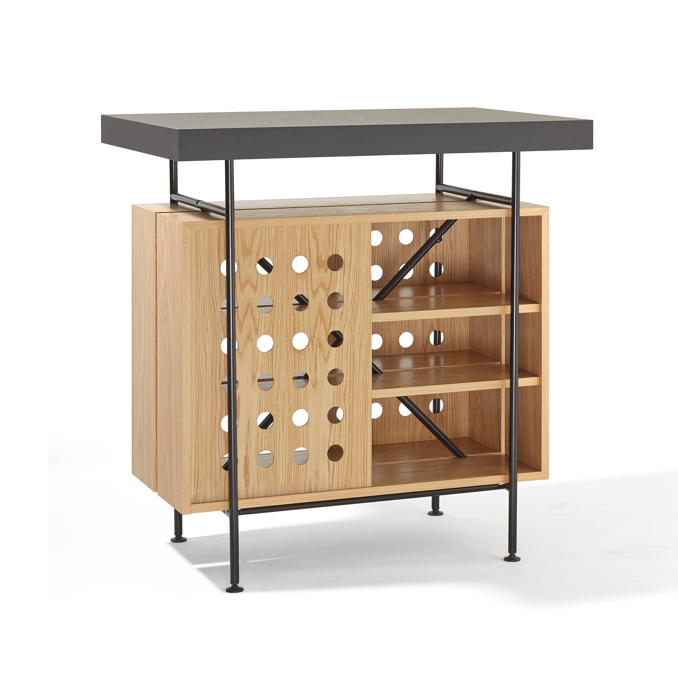 The Milla Bistro Table by Richard Lampert showcases a dark tabletop with black metal legs. The left side features a perforated design, and the right has open shelves for storage, giving it a sleek, contemporary appeal suitable as a chic bar table.