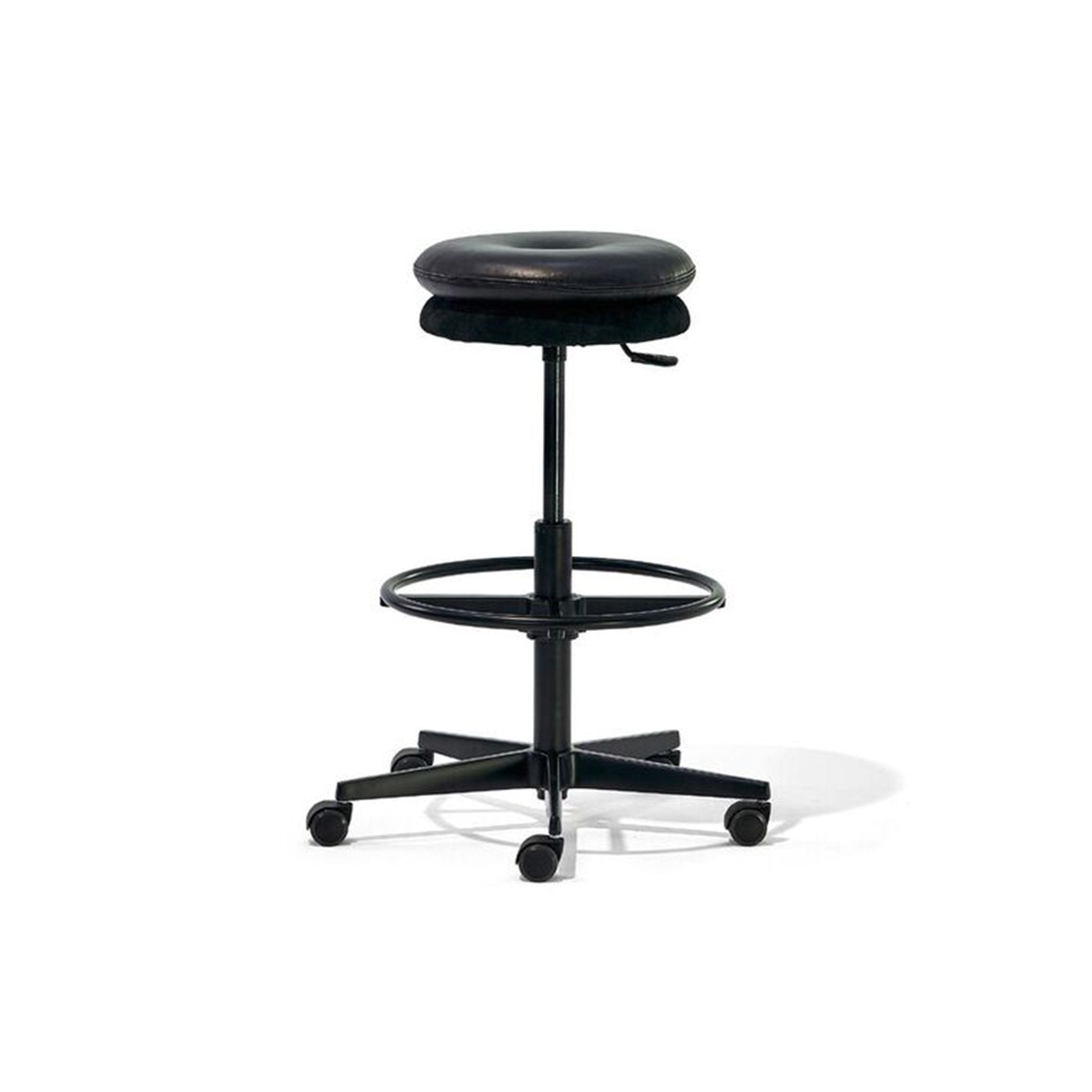 The Richard Lampert Mr. Round High Chair is a black, height-adjustable stool with a round seat and five caster wheels. It includes a circular footrest, a gas spring lever for height adjustment, and has a minimalistic design perfect for saving space in offices or workspaces.