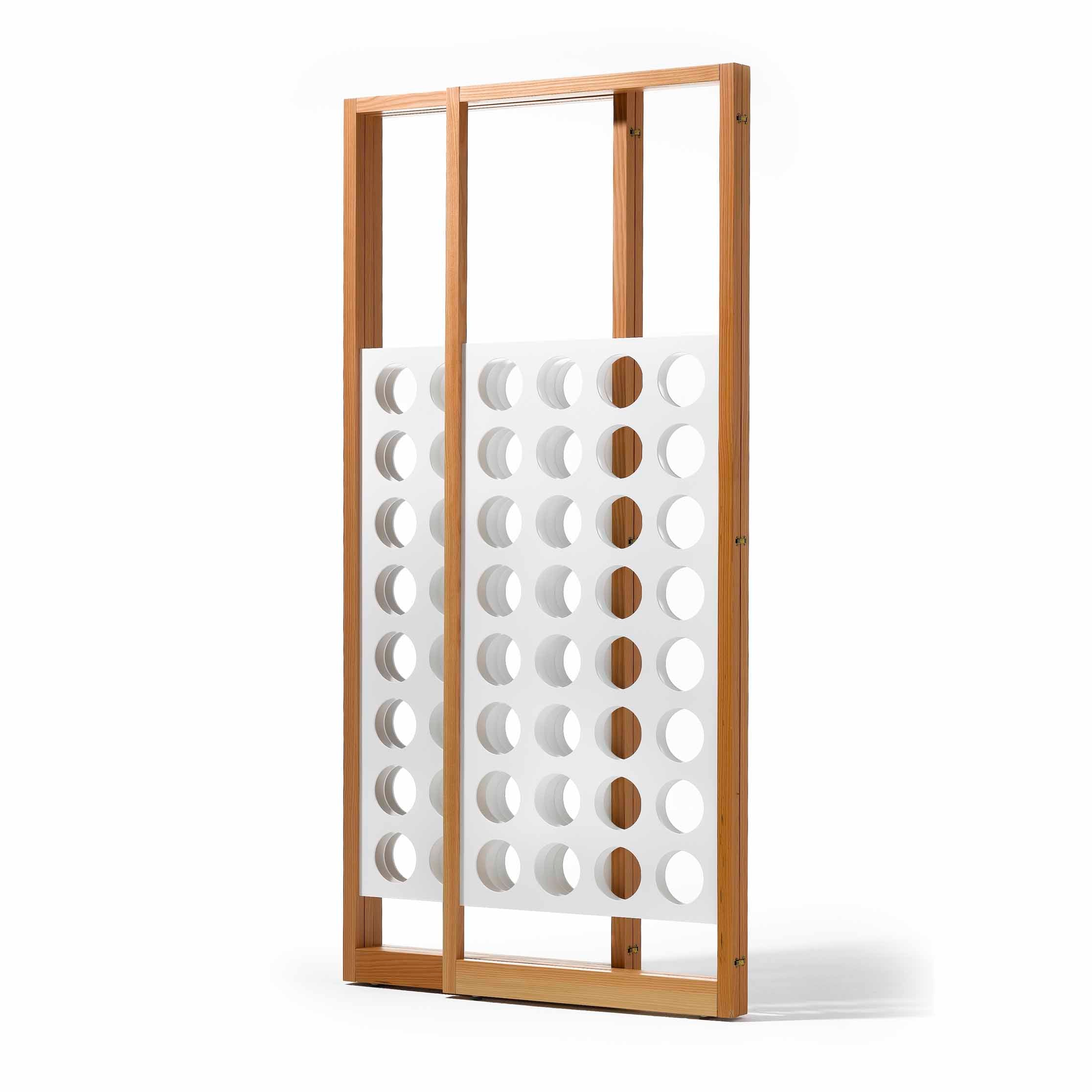 The Richard Lampert Eiermann Screen features a wooden frame with two vertical panels of grid-like, evenly spaced circular holes, styled like classic Bauhaus furniture, and stands against a plain white background.