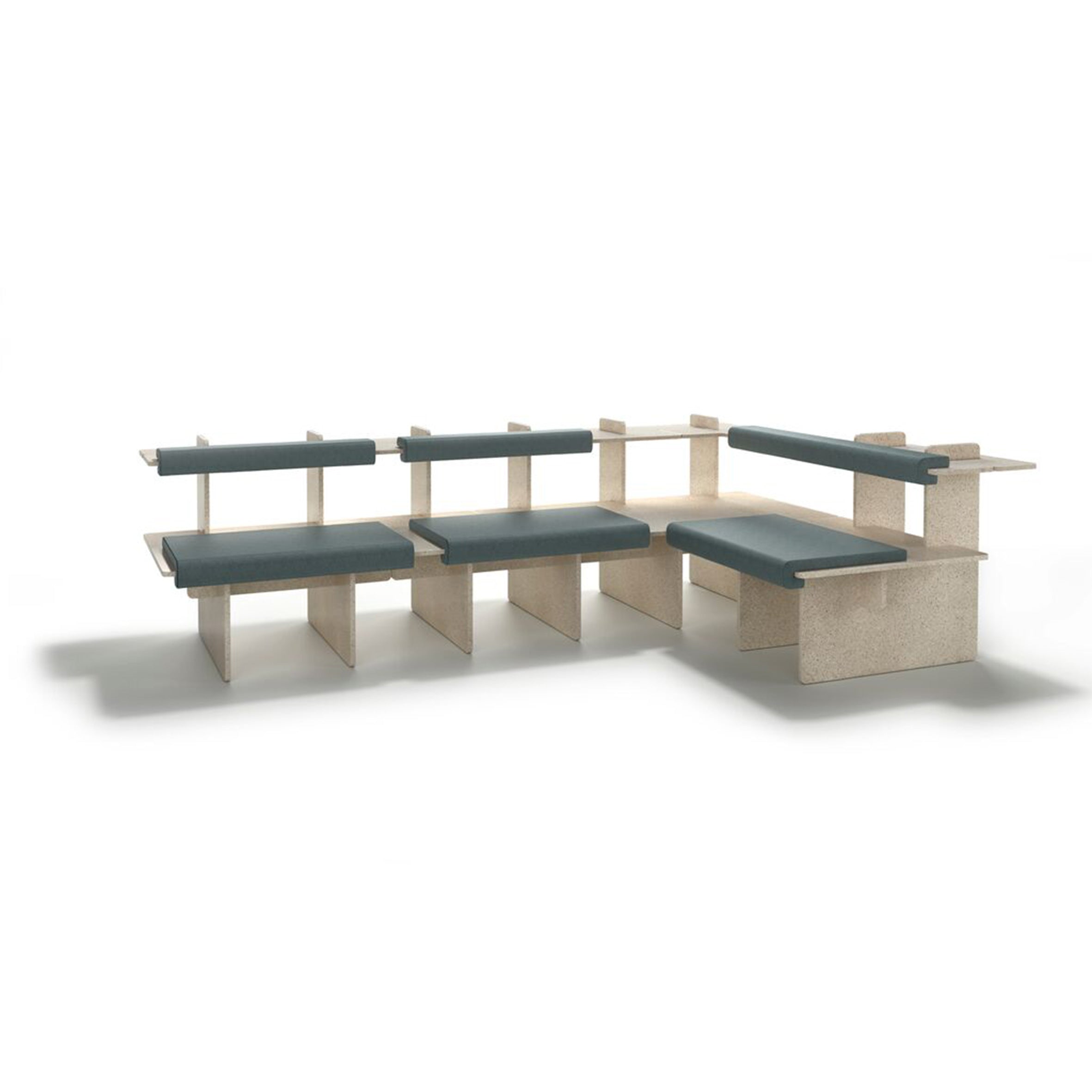 The Pip by Richard Lampert is a customizable modular seating arrangement featuring light wood panels and dark green upholstered cushions in an L-shape. Its minimalist design suits contemporary living spaces or public areas, set against a white background.