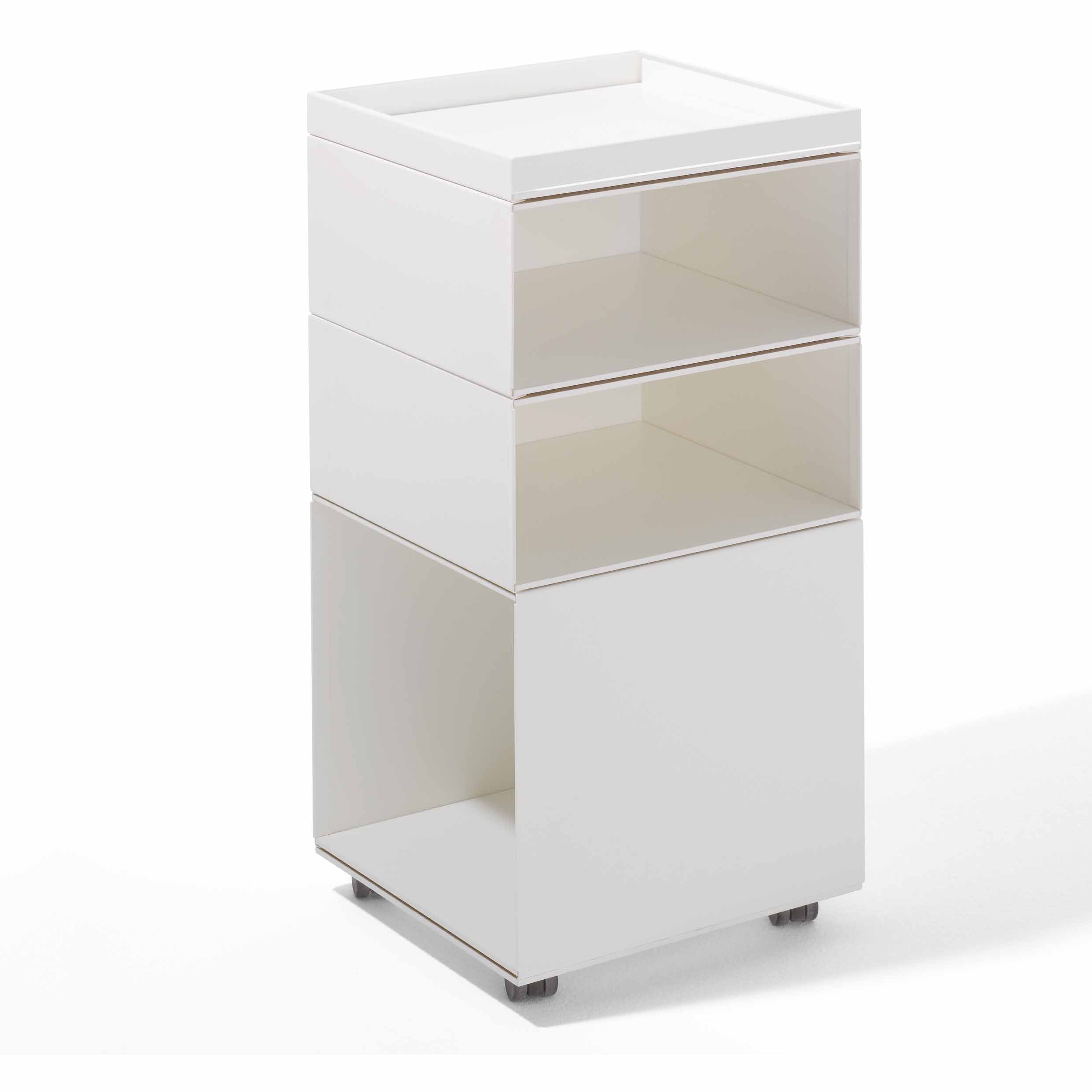 The Stak Trolley System by Richard Lampert is a modern, white storage unit with solid oak shelves offering three open compartments and a flat top. Its rectangular, minimalist design on sturdy legs delivers an innovative storage solution that adds style and functionality to any space.