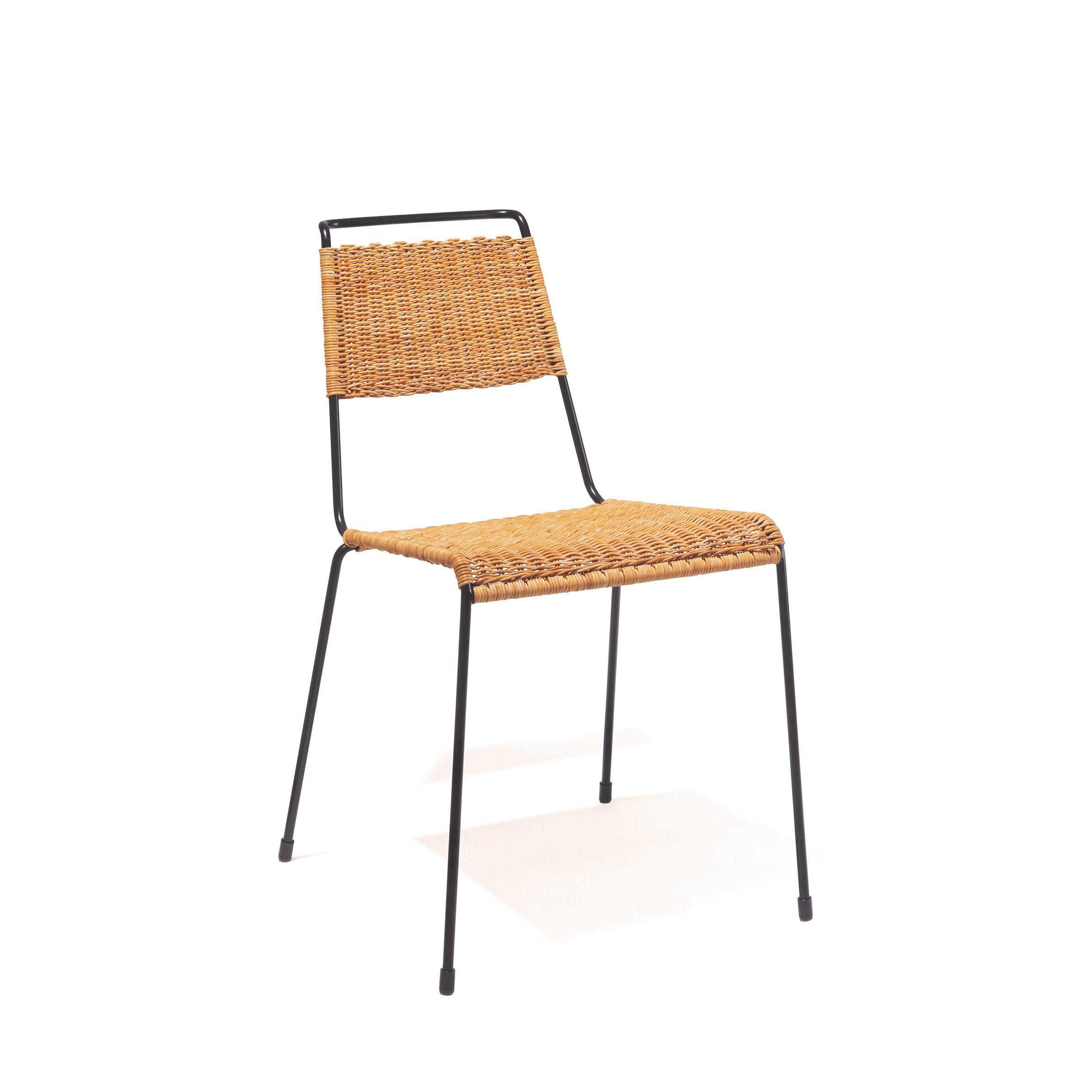The Richard Lampert TT54 Rattan chair boasts a woven rattan-style backrest and seat, ergonomic design, minimalist black metal frame, and four slender steel rod legs for a sleek look on a plain white background.