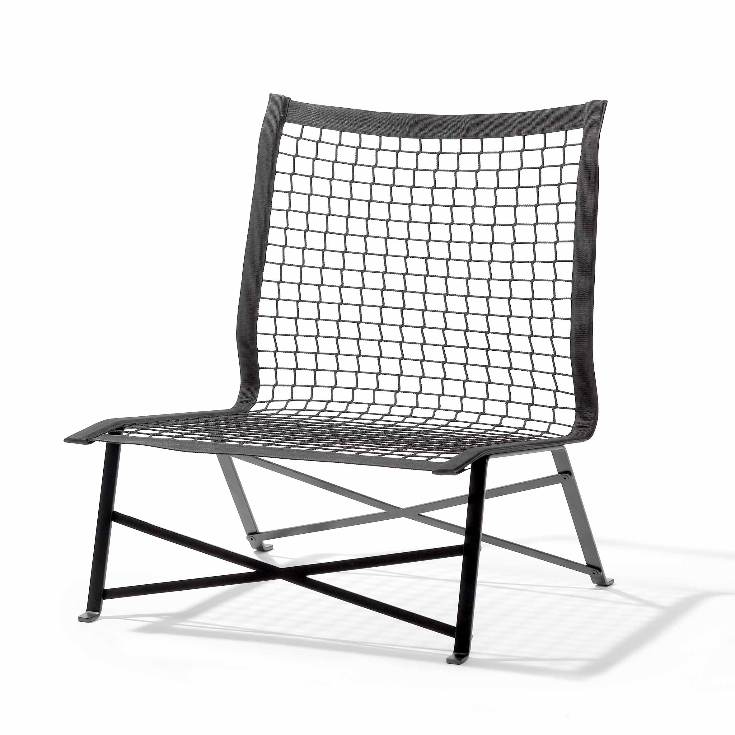 The Tie-Break Lounge Chair by Richard Lampert boasts a minimalist design with a black flat-rolled steel frame, netted backrest and seat, and crossed metal supports at the base—perfect for stylish garden or outdoor armchair settings.