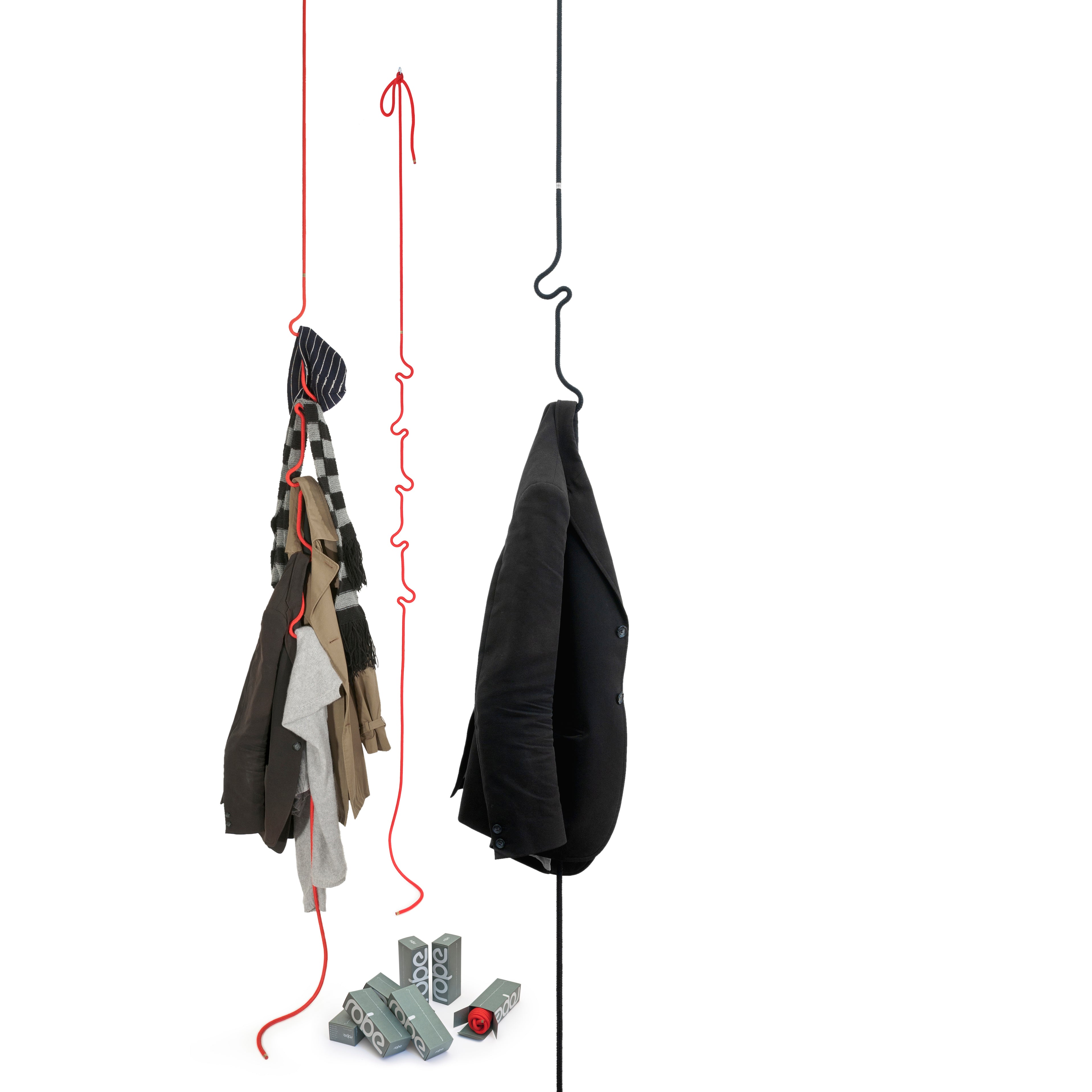 The Roberope by Roberope showcases a minimalist design with vibrant hangers displaying shirts and a jacket, all suspended from thin red and black ropes. Below, 2 kg weights rest on the gray polyester yarn.