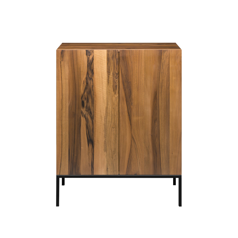 The SB03 FARIBA by E15 is a solid wood cabinet with a natural finish and vertical wood grain patterns, set on slender black metal legs for a modern, minimalistic design.