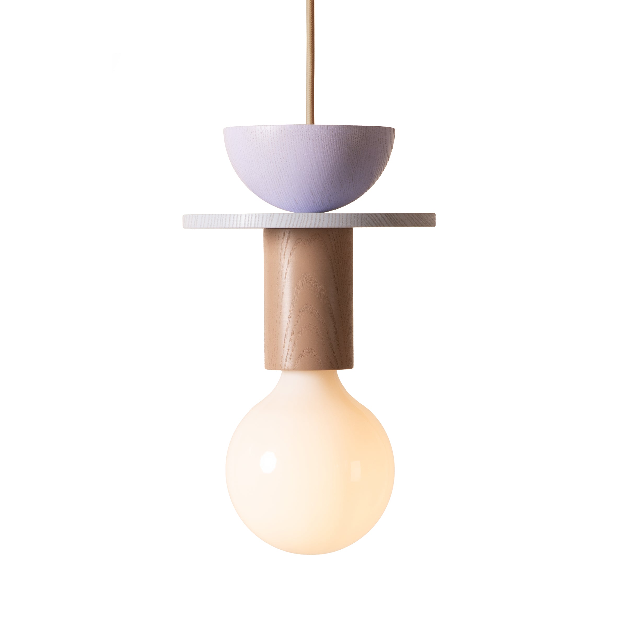 The Junit Toffee by Schneid is a minimalist pendant light, inspired by the Bauhaus movement, with a large round bulb. It features a wooden cylindrical holder, a small purple bowl on top, and a white circular disc that separates the bulb and bowl for an ambient glow and modern geometric design.